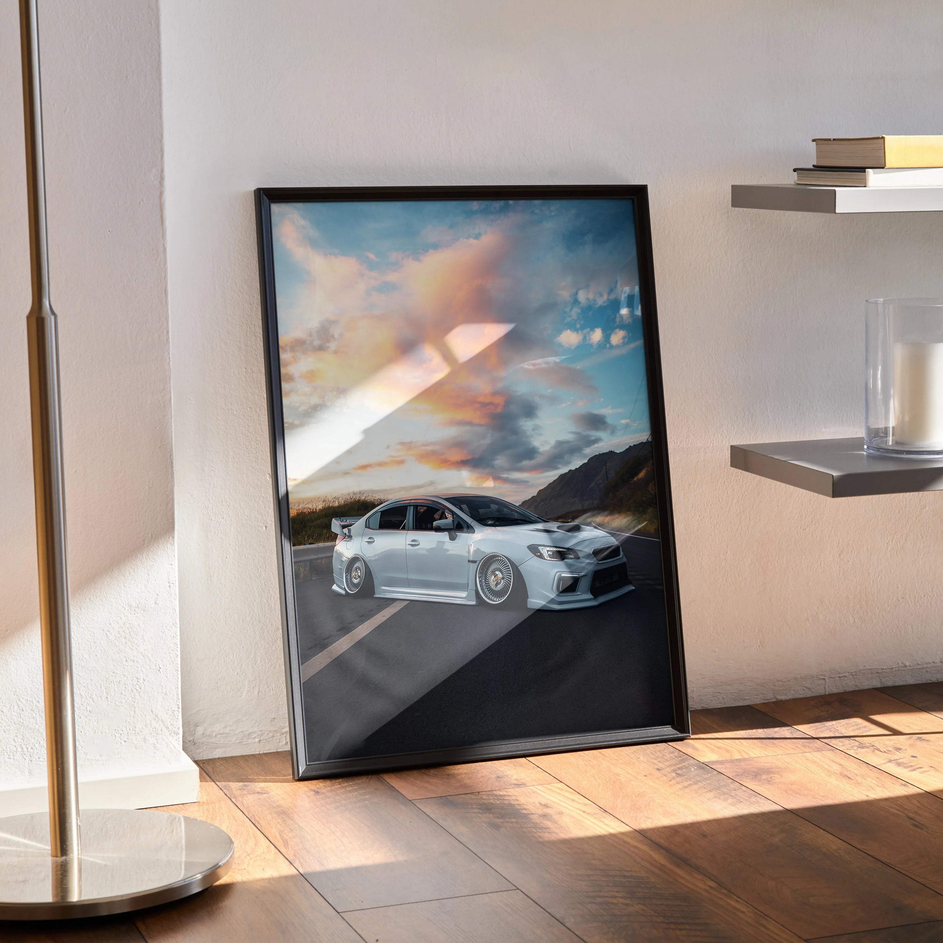 Subaru WRX parked on mountain road at sunset poster wall art in black frame.