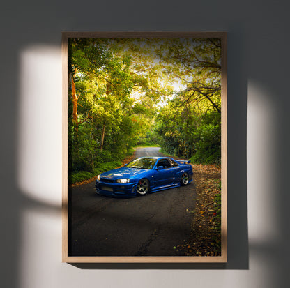 Nissan Skyline GTR R34 blue car poster with forest road background wall art in wooden frame.