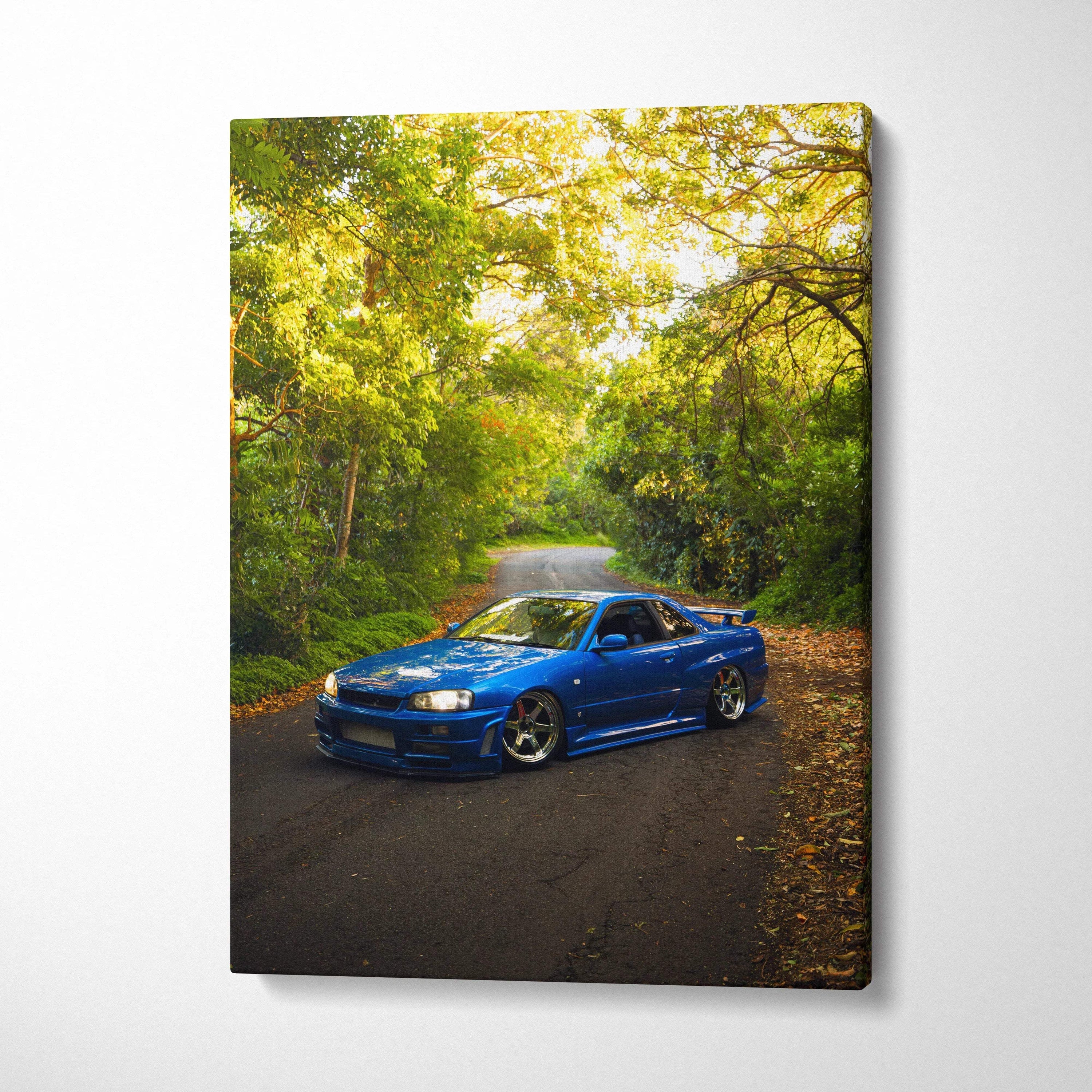 Blue Nissan GTR R34 Skyline on forest road canvas wall art print in vertical format.