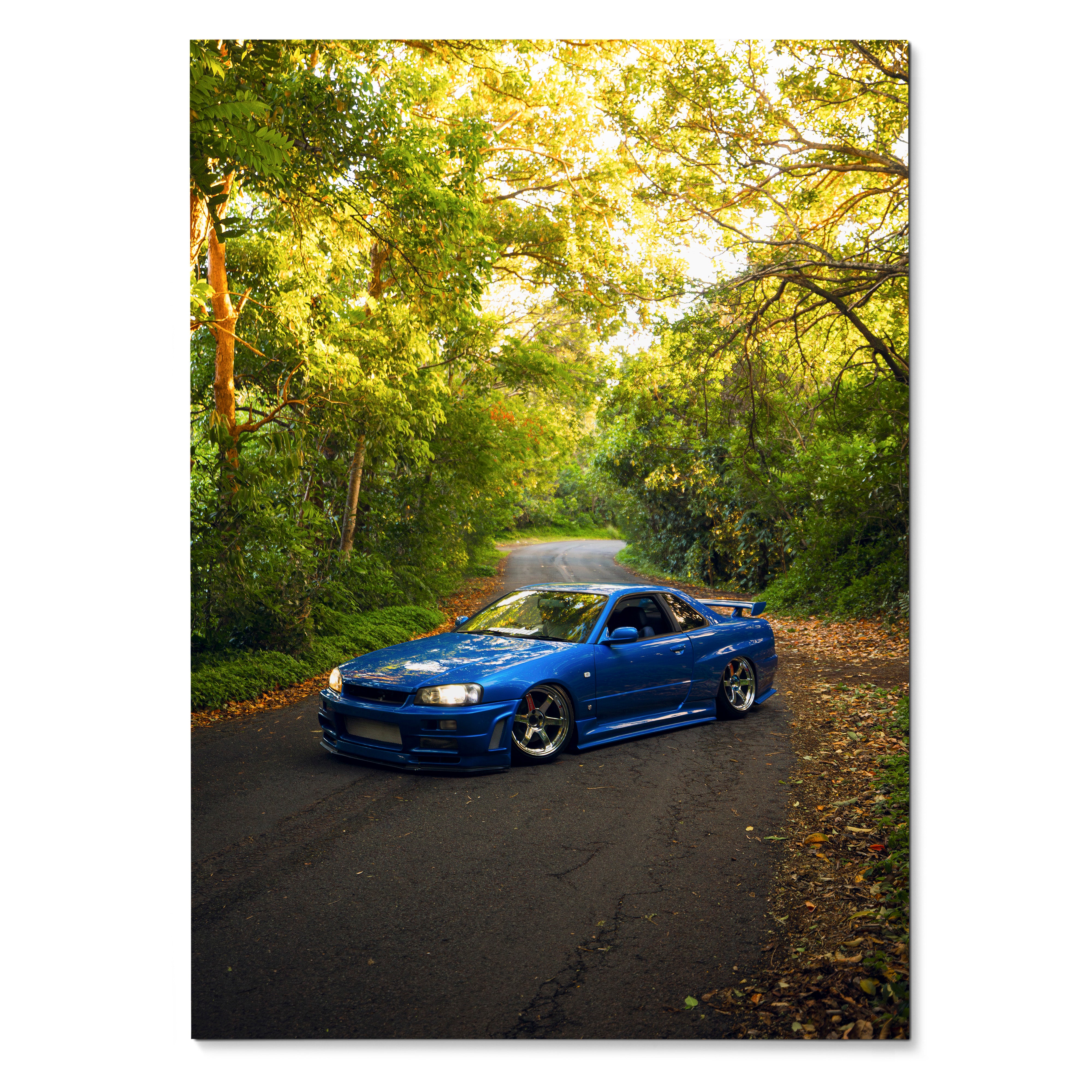 Nissan Skyline R34 GTR blue car on forest road poster wall art in vibrant green setting.