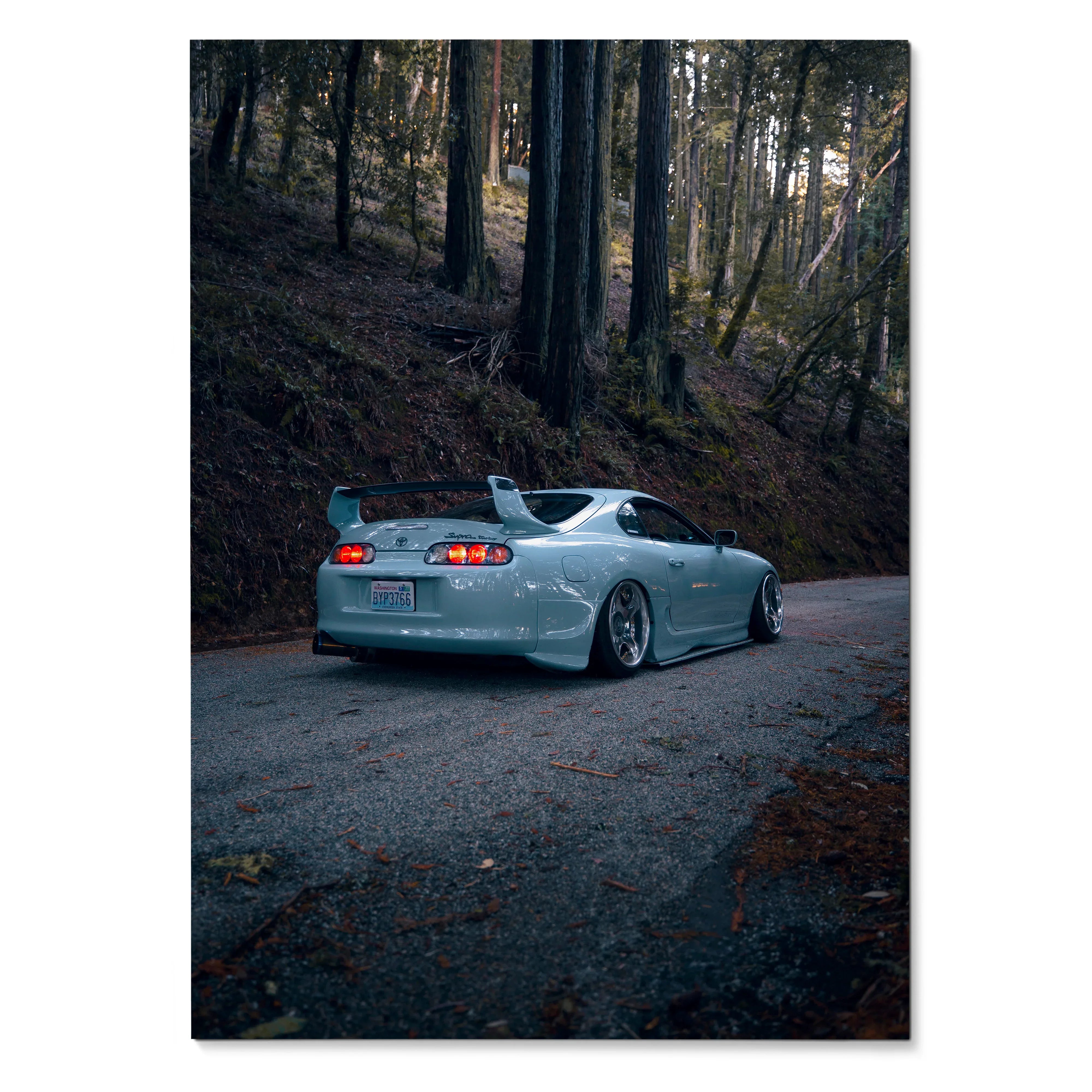 Toyota Supra Mk4 in silver parked on forest road at dusk wall art poster.