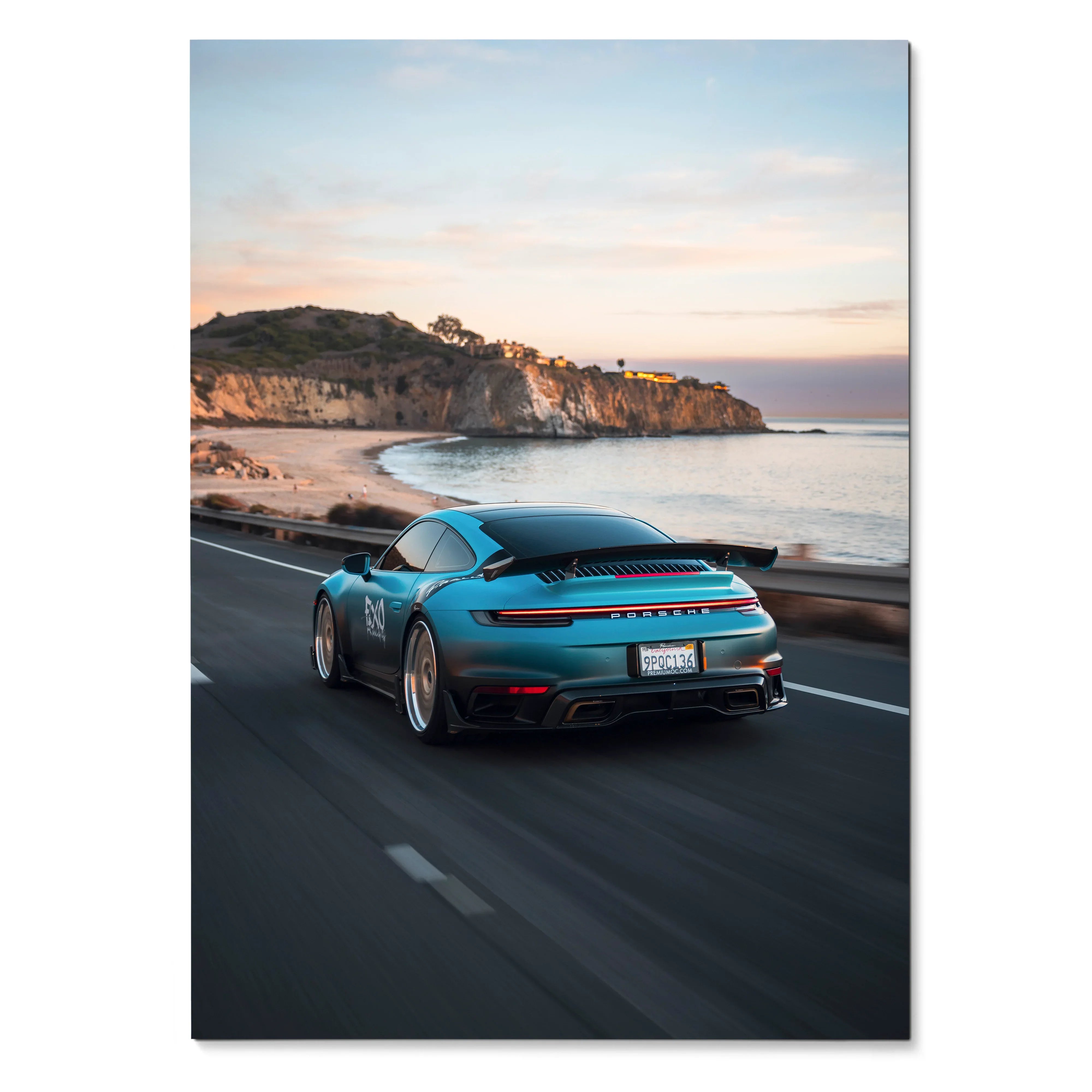 Porsche 911 driving along coastal road at sunset Poster Wall Art with scenic cliffs and ocean.