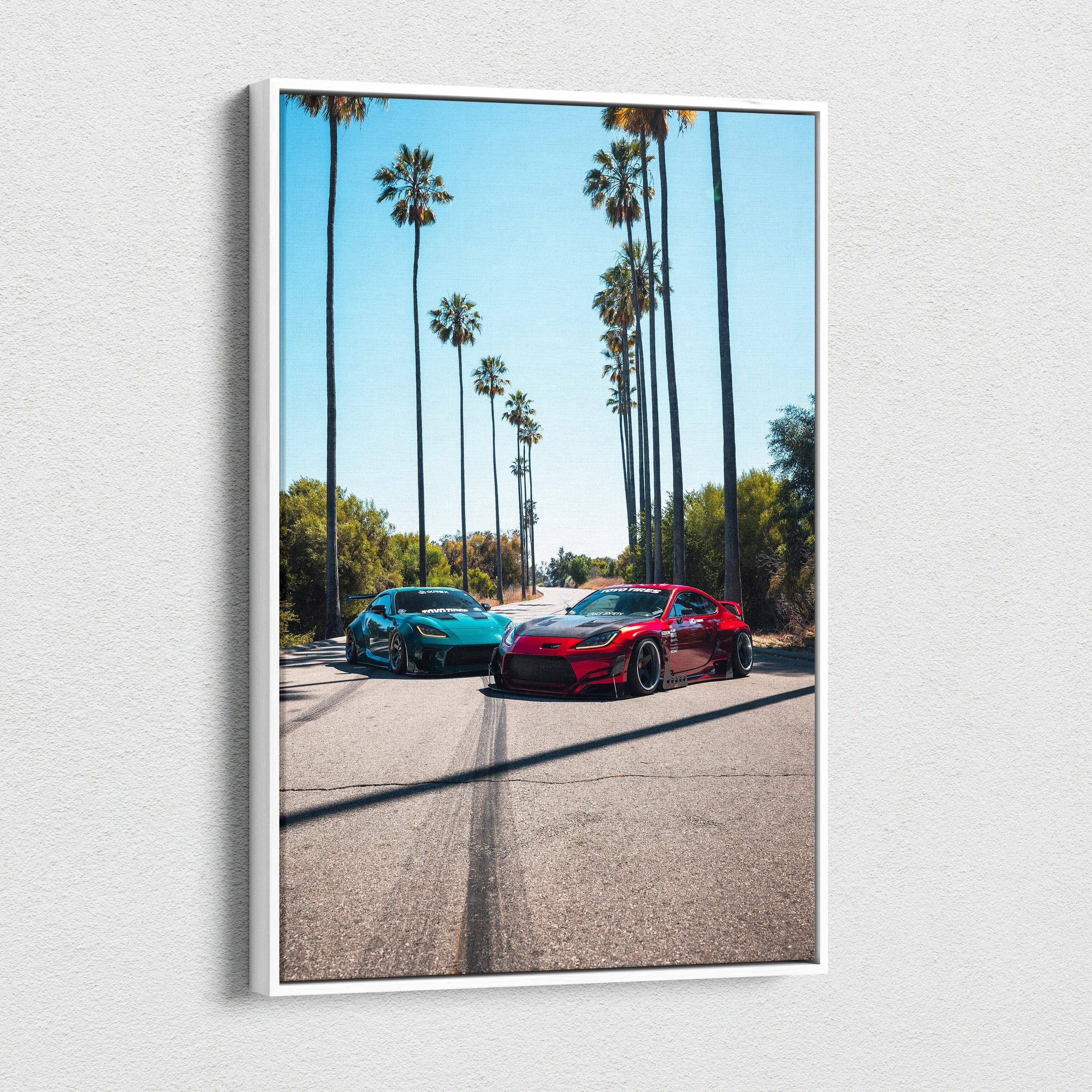 Vertical canvas art of two Toyota GR86 cars on a sunny palm tree-lined street, wall art print.