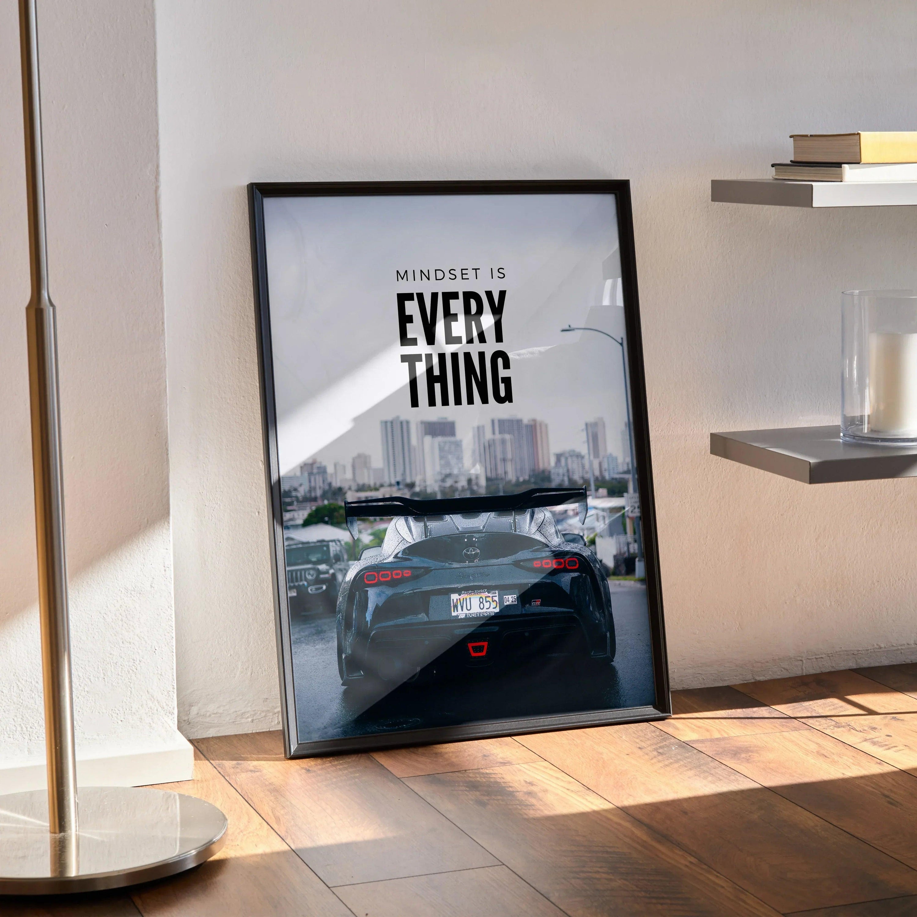 Toyota Supra Mk5 poster with motivational text and city skyline, modern wall art in black frame.