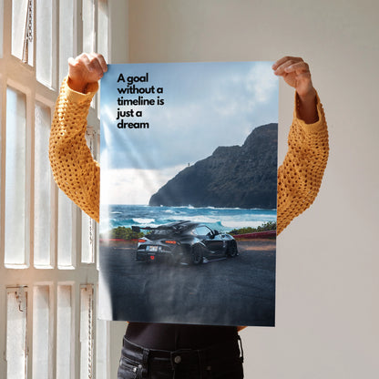 Motivational poster wall art featuring Toyota Supra Mk5 on coastal road with text "A goal without a timeline is just a dream".