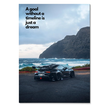 Motivational poster wall art featuring black Toyota Supra Mk5 by ocean with inspiring text on sky.
