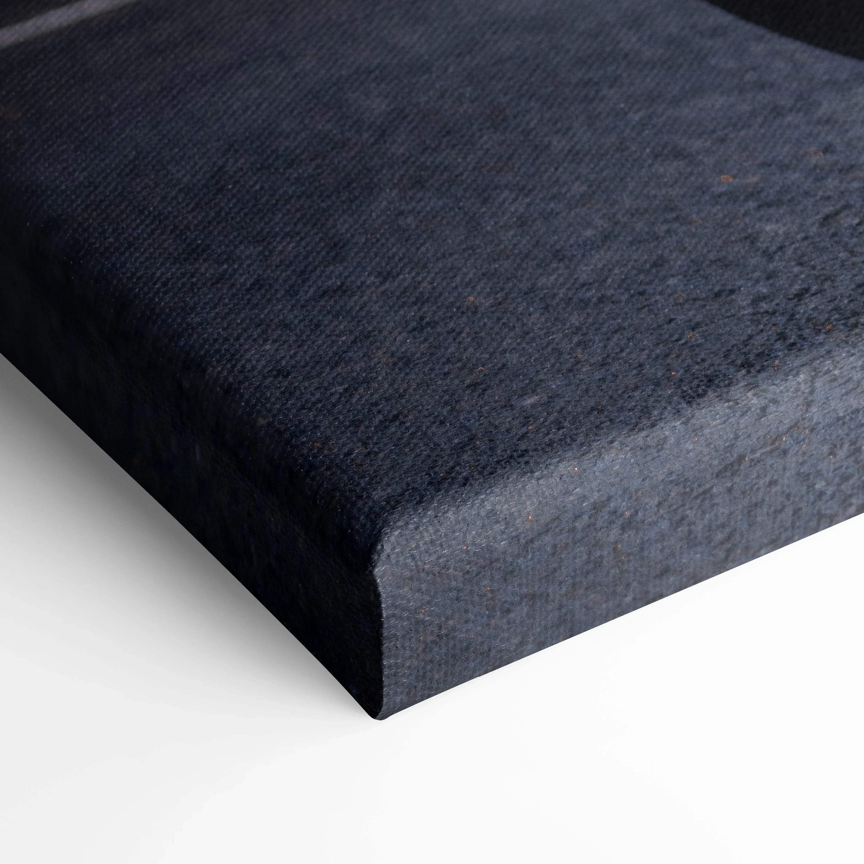 Close-up of black textured canvas wrap corner for vertical wall art canvas print.