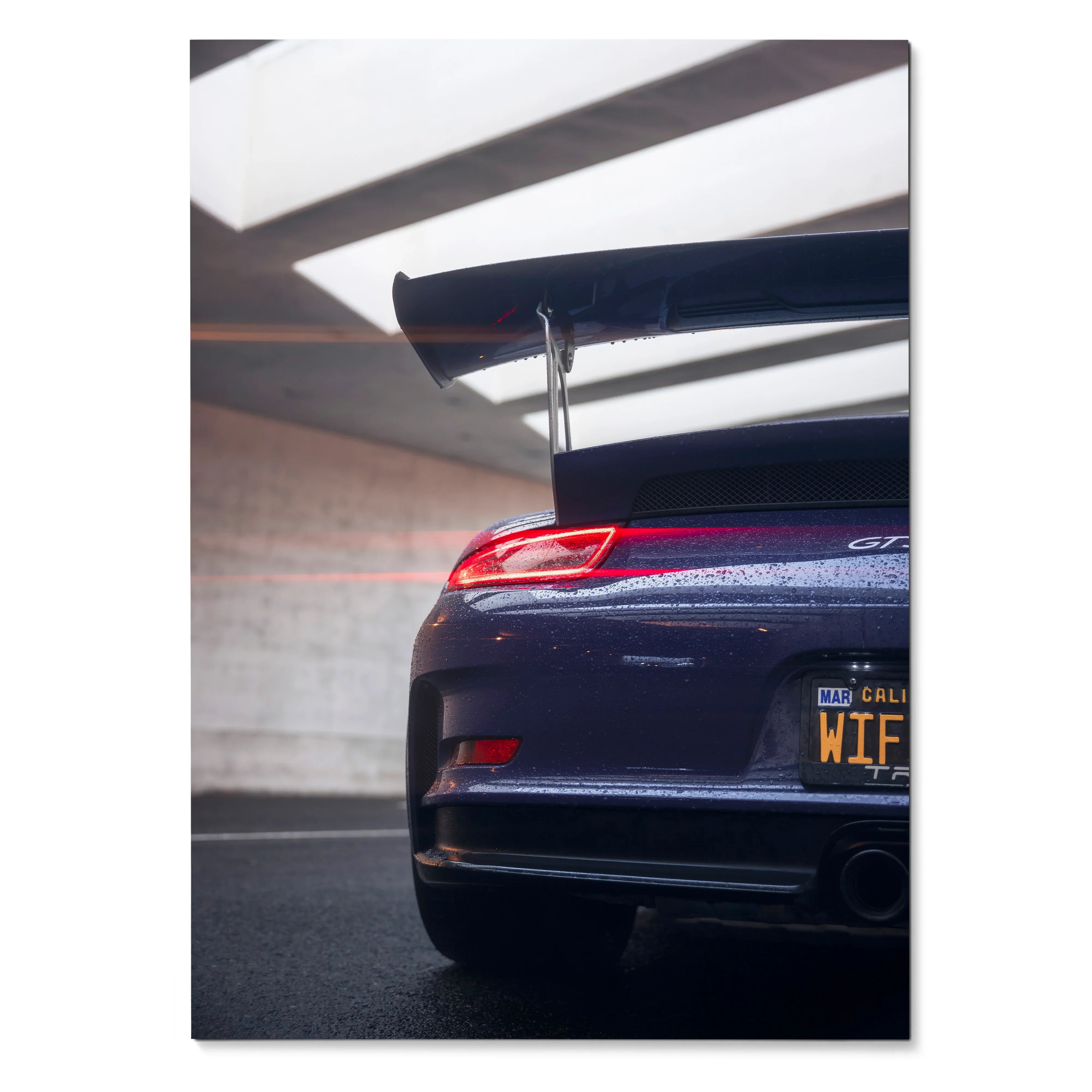 Porsche 911 GT3 RS rear view with prominent spoiler in moody lighting, high-resolution poster wall art.