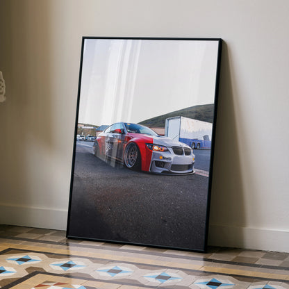 BMW E92 M3 racing car poster displayed as sleek wall art with a modern black frame.
