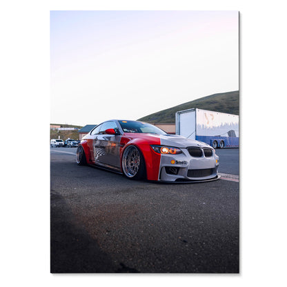 BMW E92 M3 in red and gray with lowered body and aftermarket wheels poster wall art.