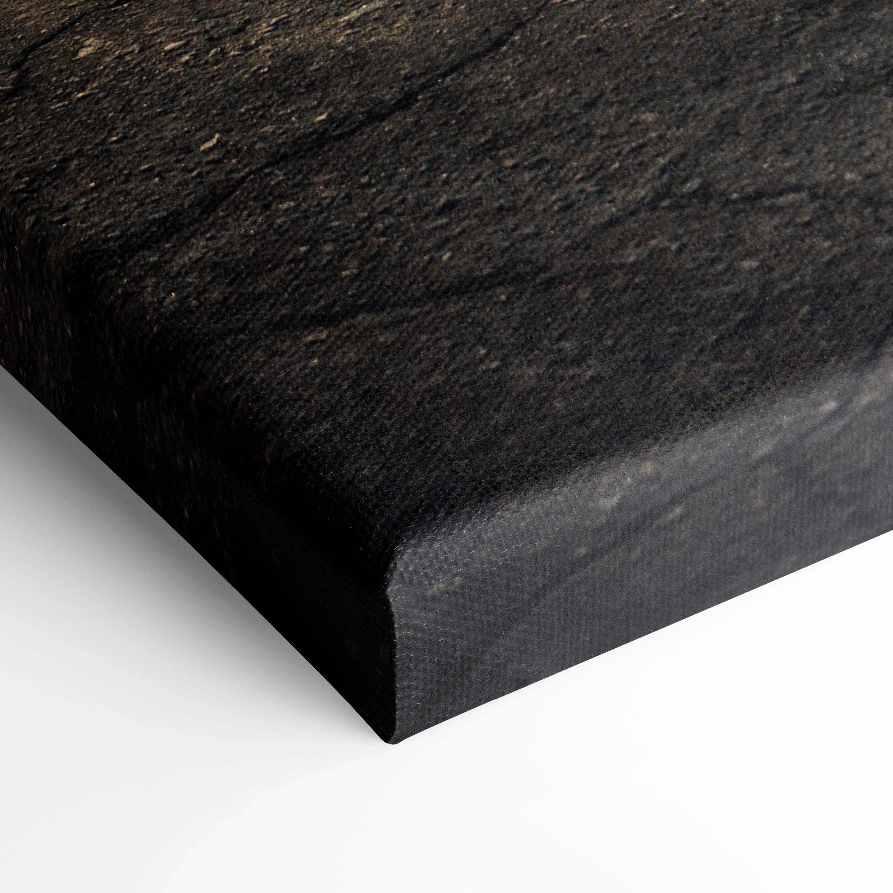 Close-up of black textured canvas edge highlighting high-quality wall art material.