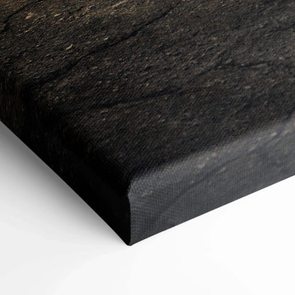 Close-up of black textured canvas edge highlighting high-quality wall art material.