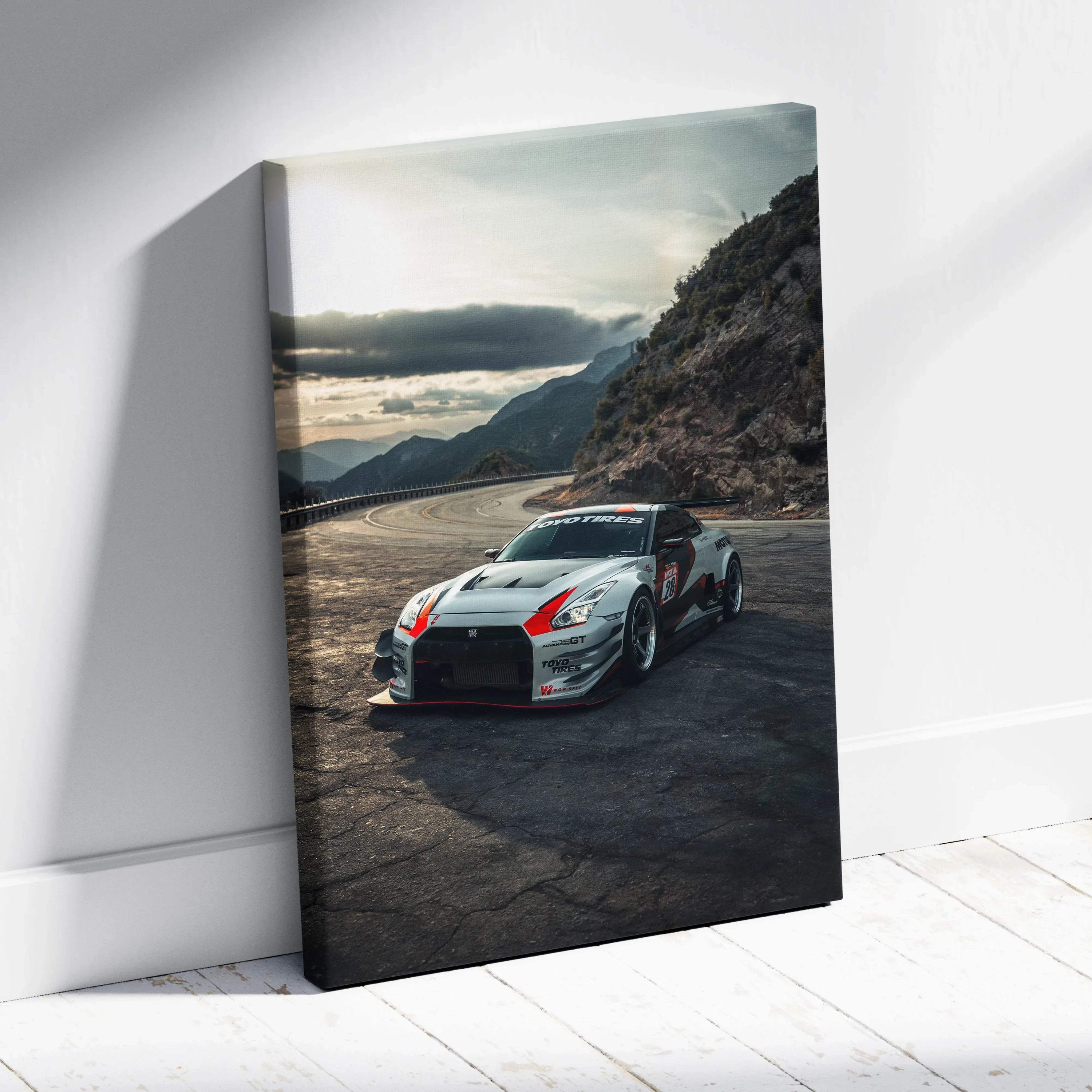 Nissan R35 GTR car canvas wall art with dramatic mountain landscape background and sunset sky.