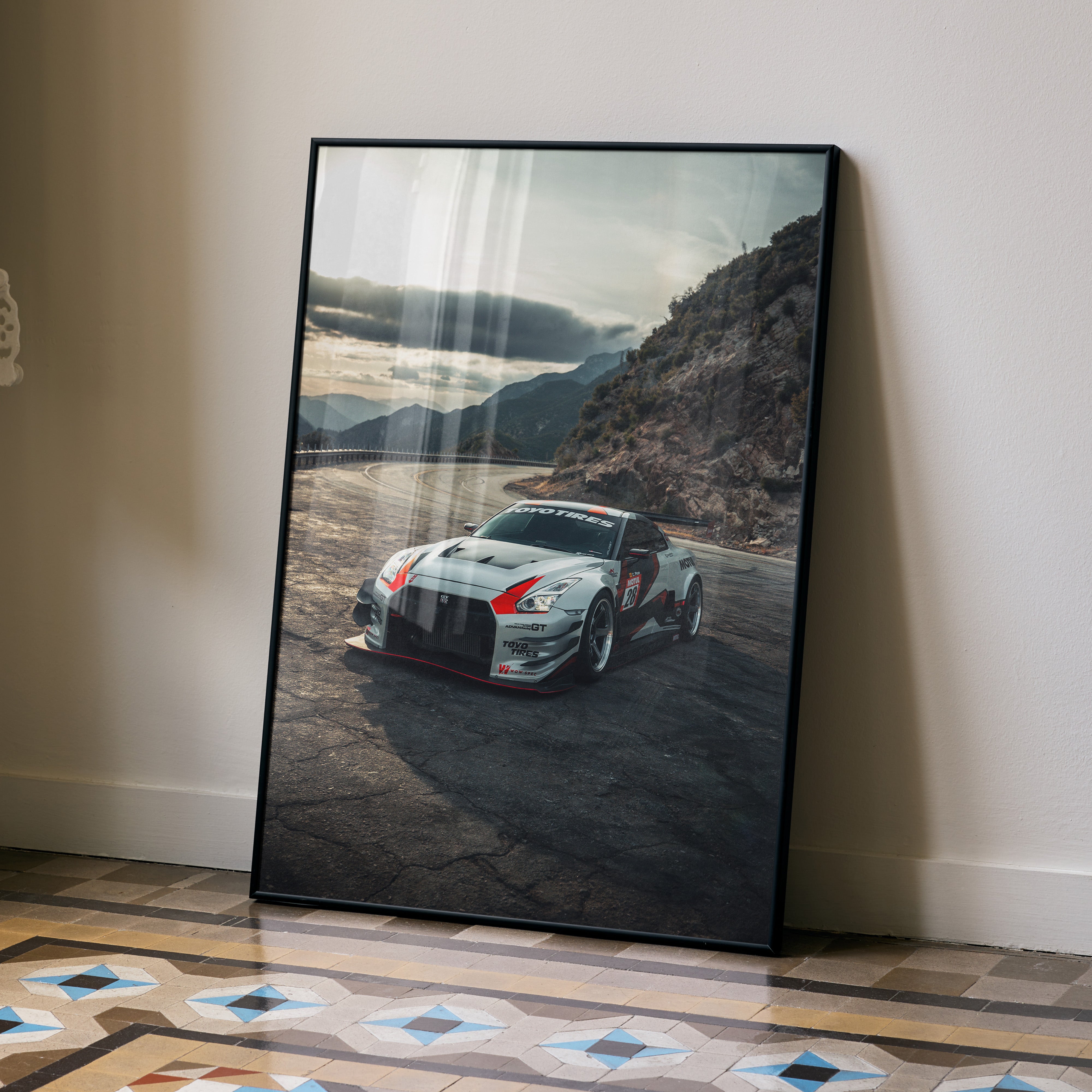 Nissan GTR R35 racing car high resolution poster leaning on wall with mountain background wall art.