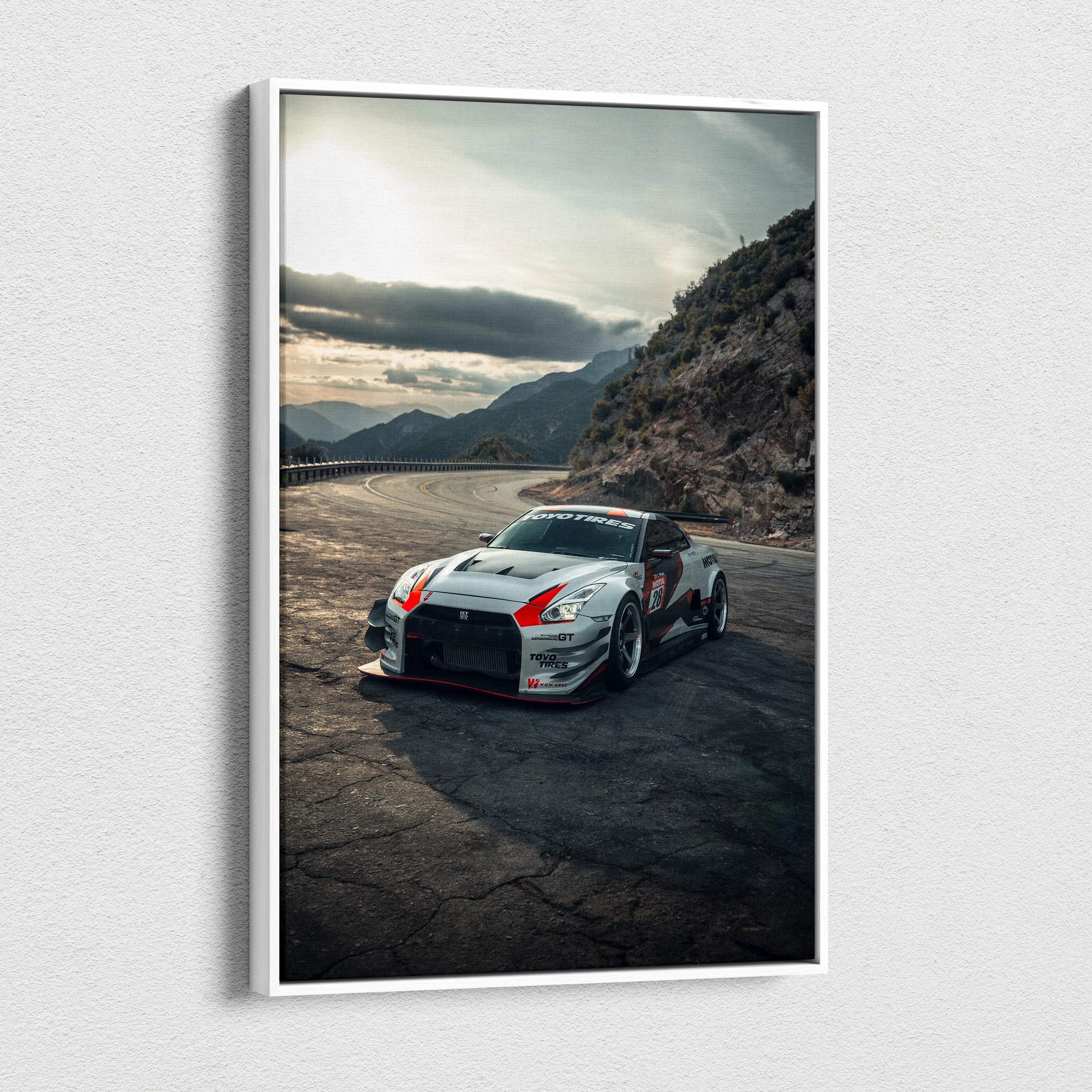 Nissan R35 GTR racing car on mountain road canvas wall art with dramatic sky backdrop.