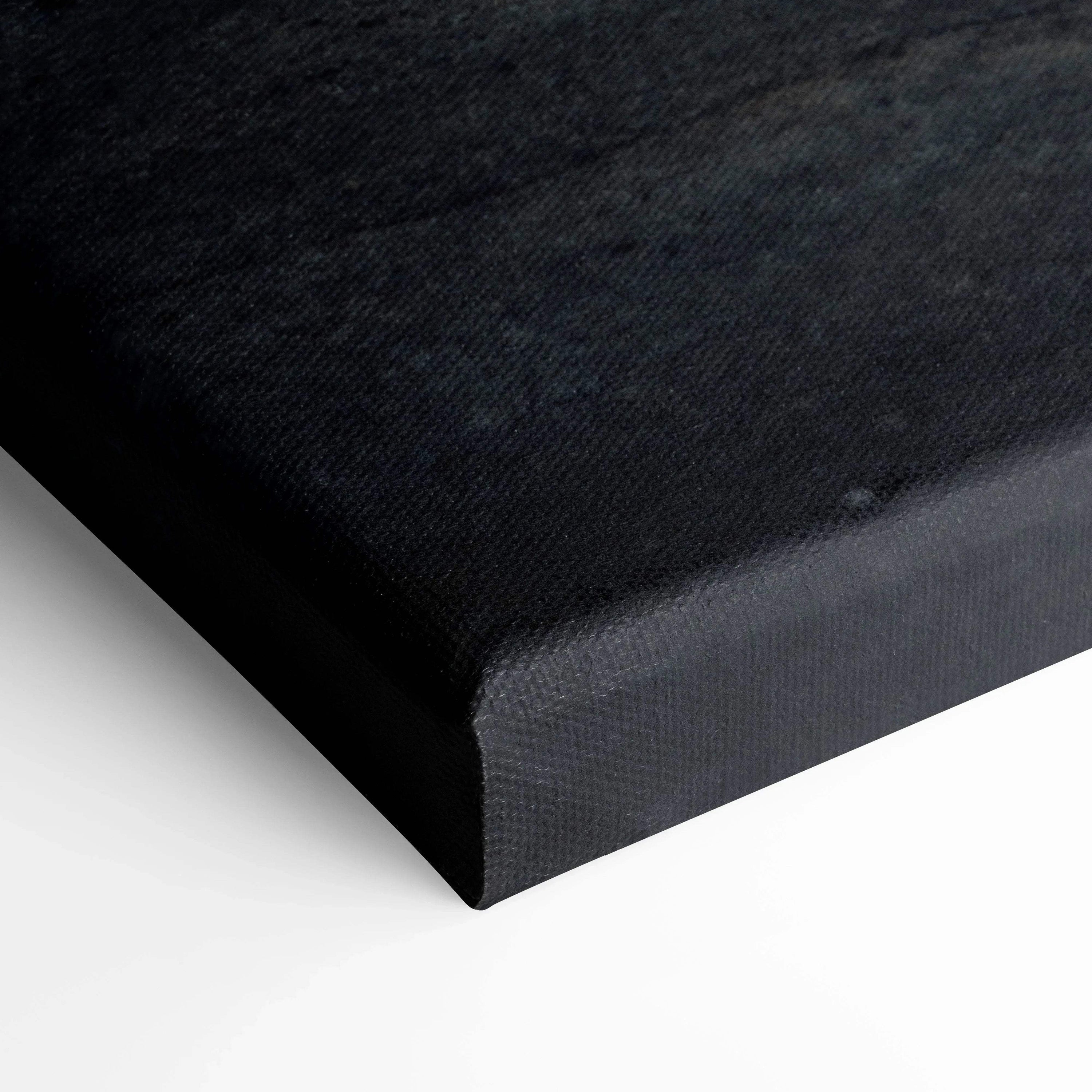 Black wrapped edge of a Nissan R35 GTR vertical canvas art print on white background.