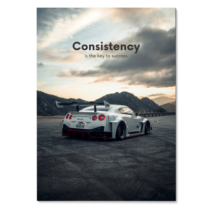 Motivational poster wall art featuring white Nissan R35 GT-R with "Consistency is the key to success" text against a.