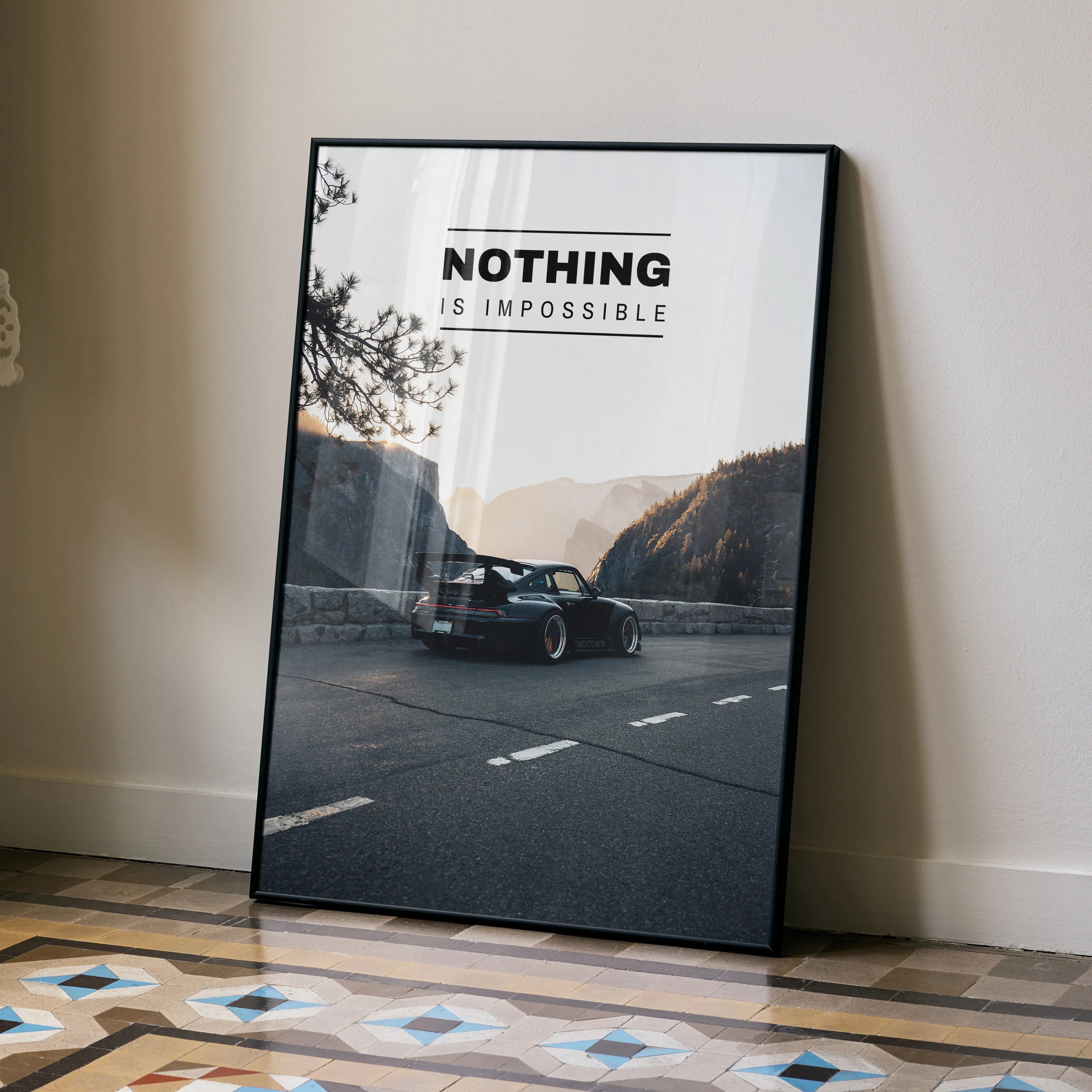 Motivational poster wall art featuring a black RWB Porsche 911 with "Nothing is impossible" text against a mountain road.