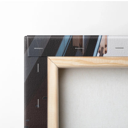 Close-up of wooden-framed vertical canvas wall art with high-resolution print detail.
