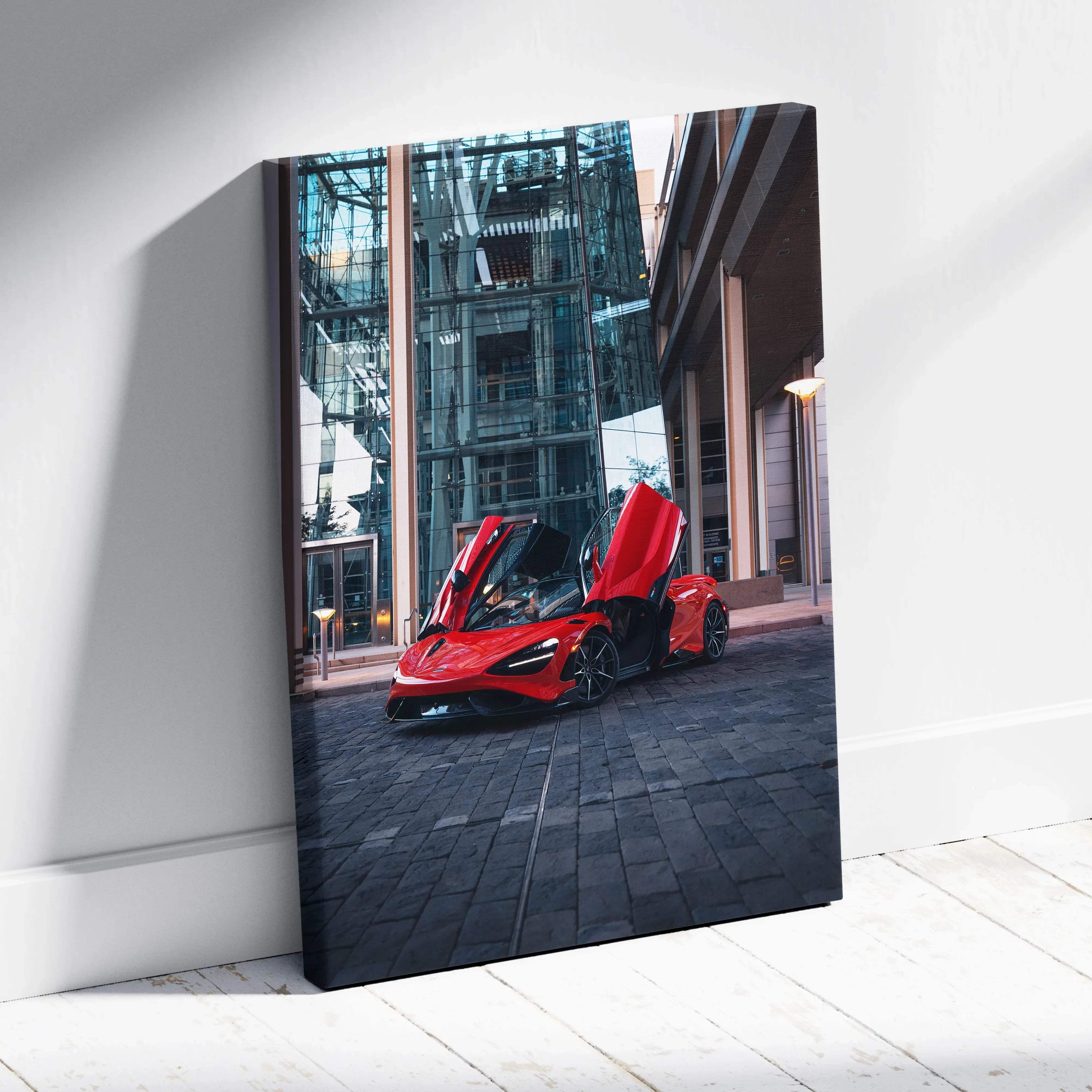 Canvas wall art vertical car print featuring a vibrant red mclaren 765lt with gull-wing doors in an urban setting