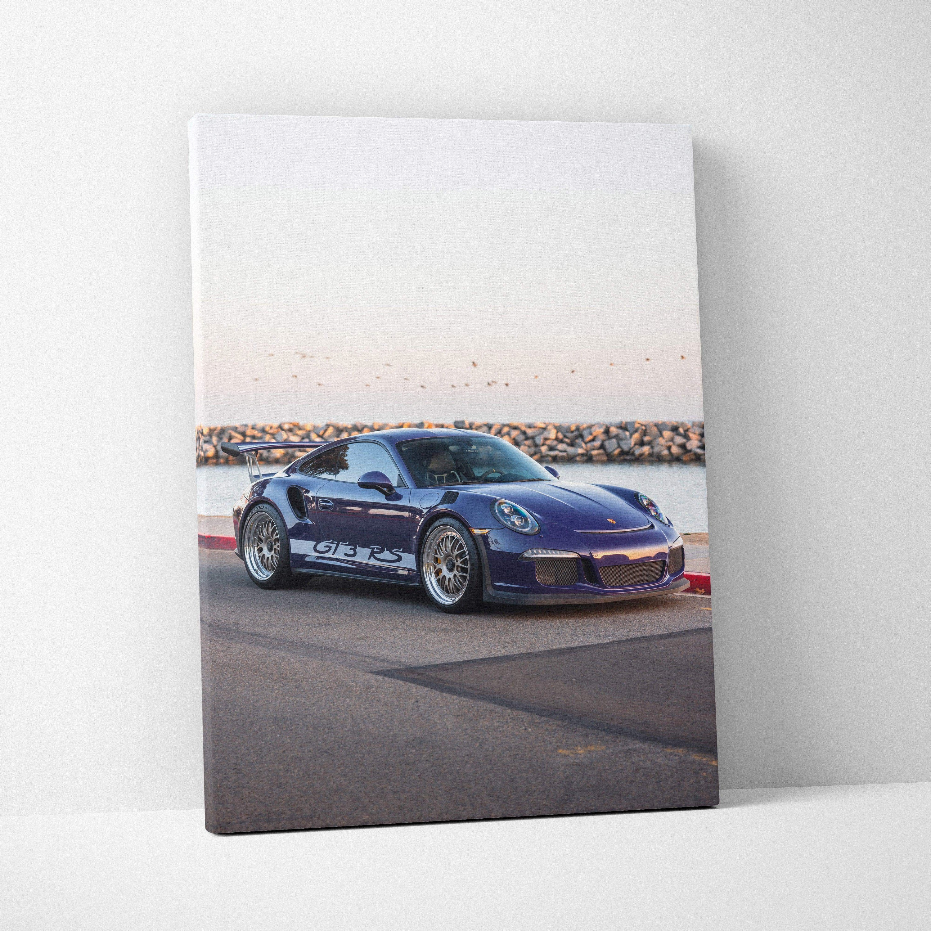Porsche 911 GT3 RS in blue on road by water canvas wall art vertical print.