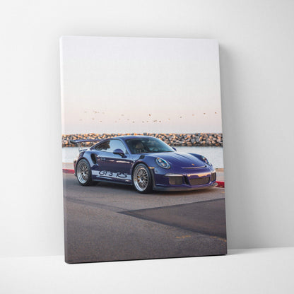 Porsche 911 GT3 RS in blue on road by water canvas wall art vertical print.