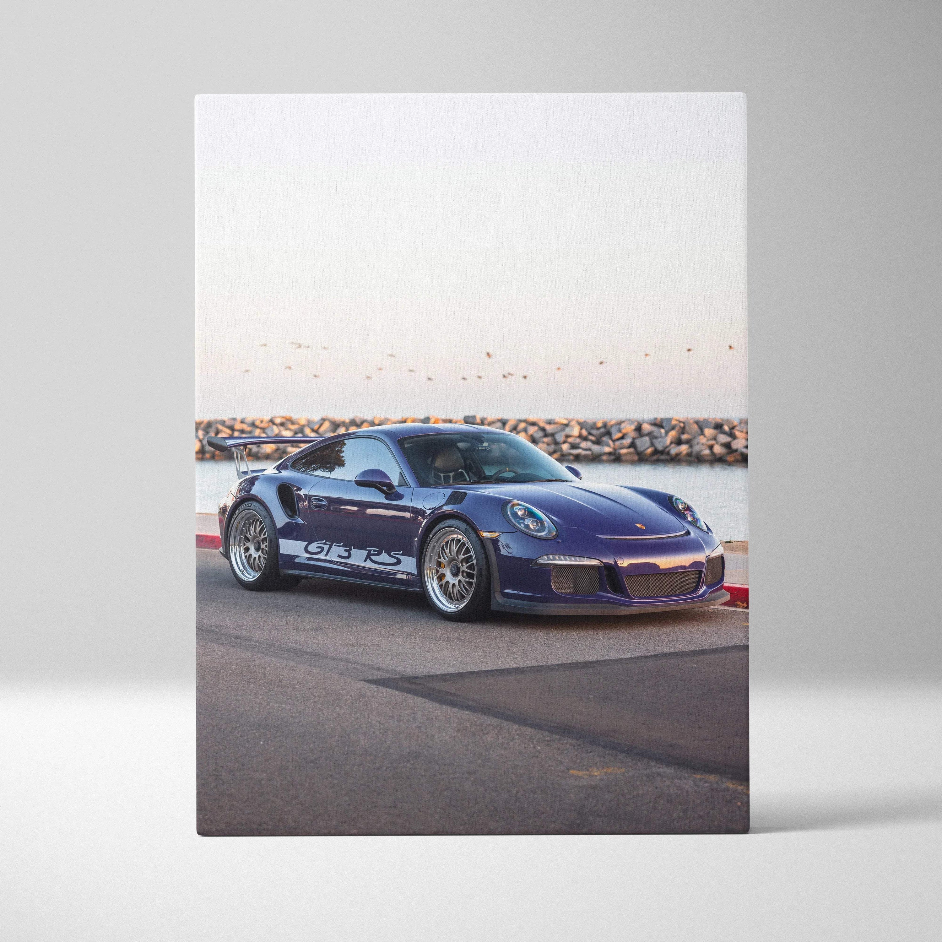 Blue Porsche 911 GT3 RS parked by waterfront on vertical canvas wall art.