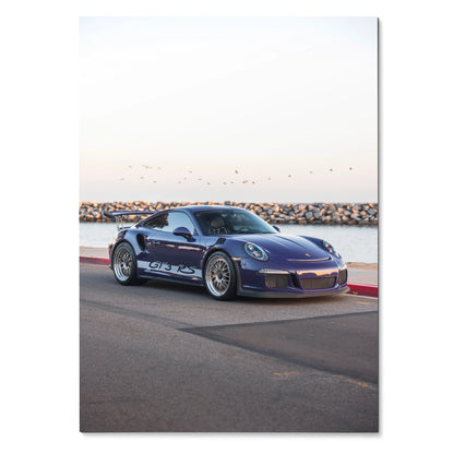 Blue Porsche 911 GT3 RS parked on road by waterfront poster wall art.