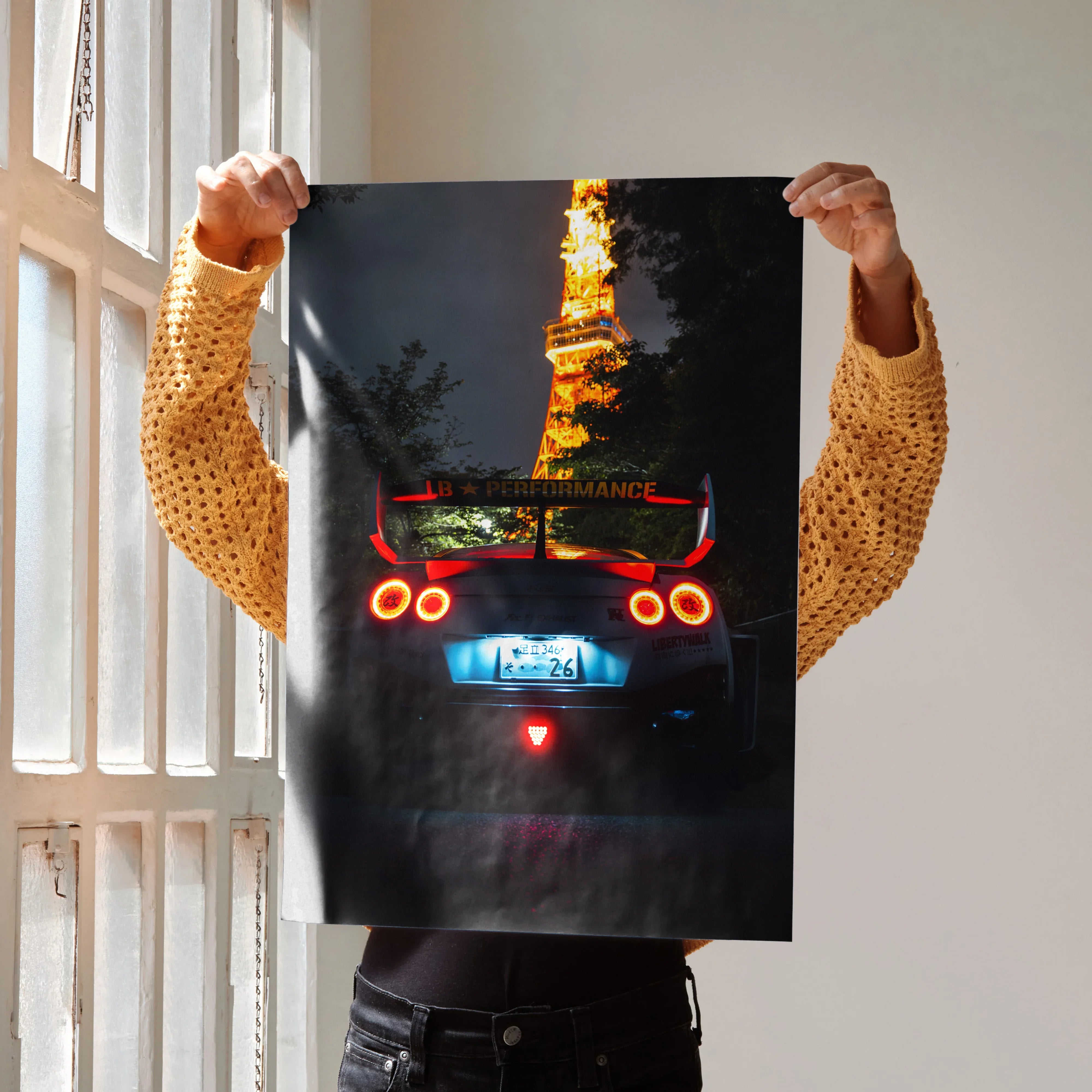 Nissan GT-R R35 with illuminated taillights and Tokyo Tower in background poster wall art.