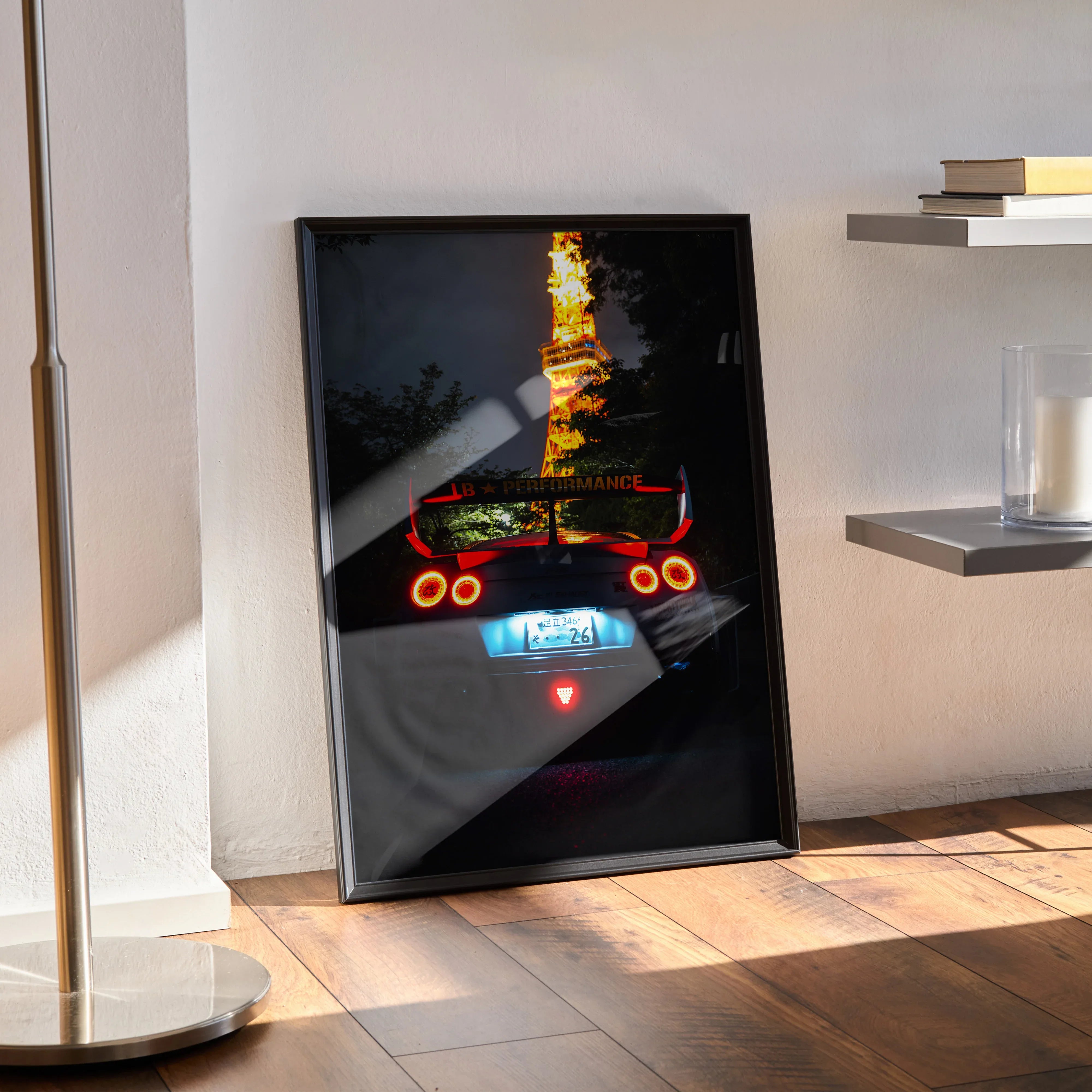 Nissan GT-R R35 poster with illuminated rear lights and fire reflections, modern wall art in black frame.