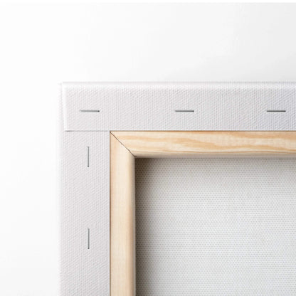 Close-up of wooden frame corner with white stretched canvas for vertical wall art or canvas art display.