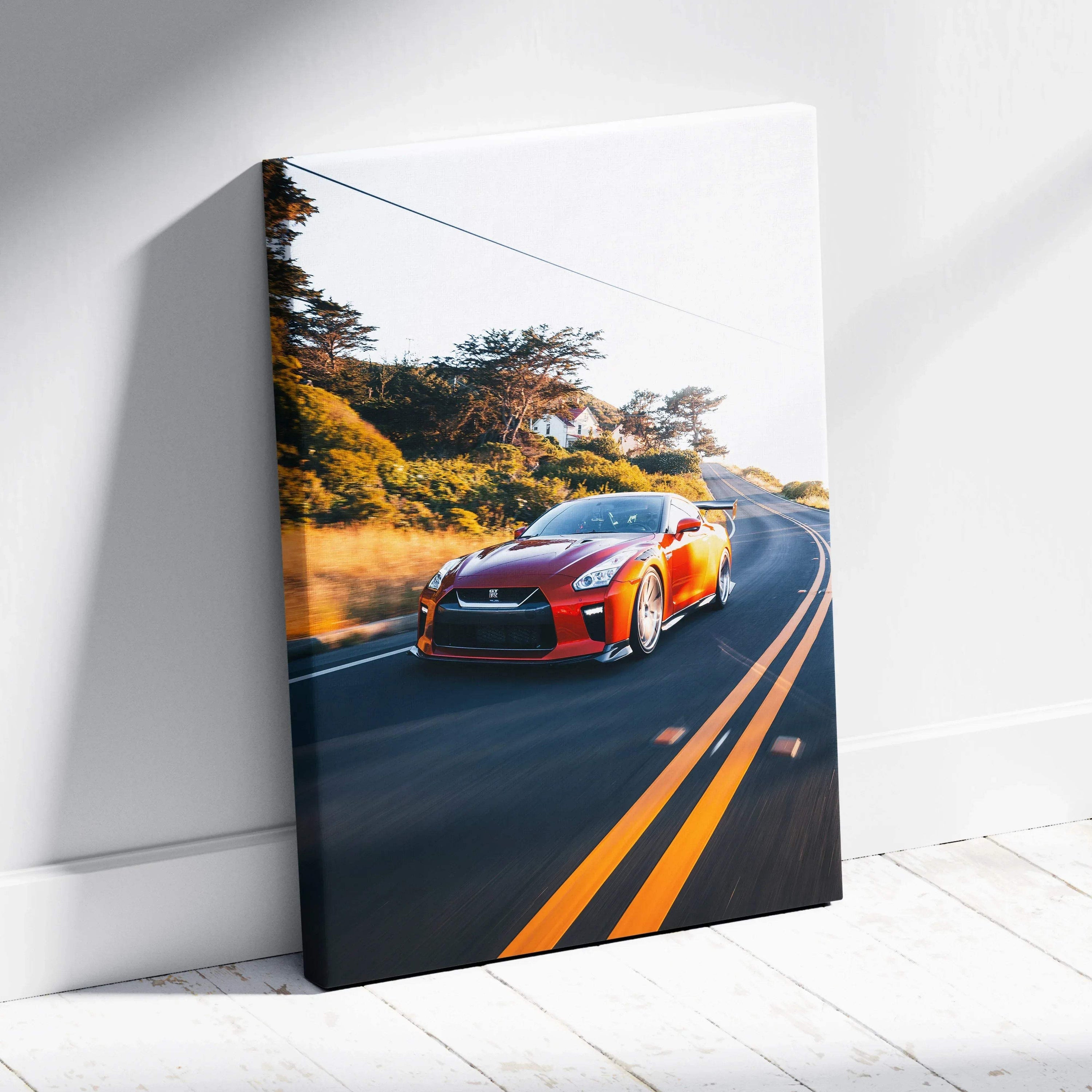 Red Nissan R35 GTR driving on scenic road canvas wall art with vibrant colors and sharp details.