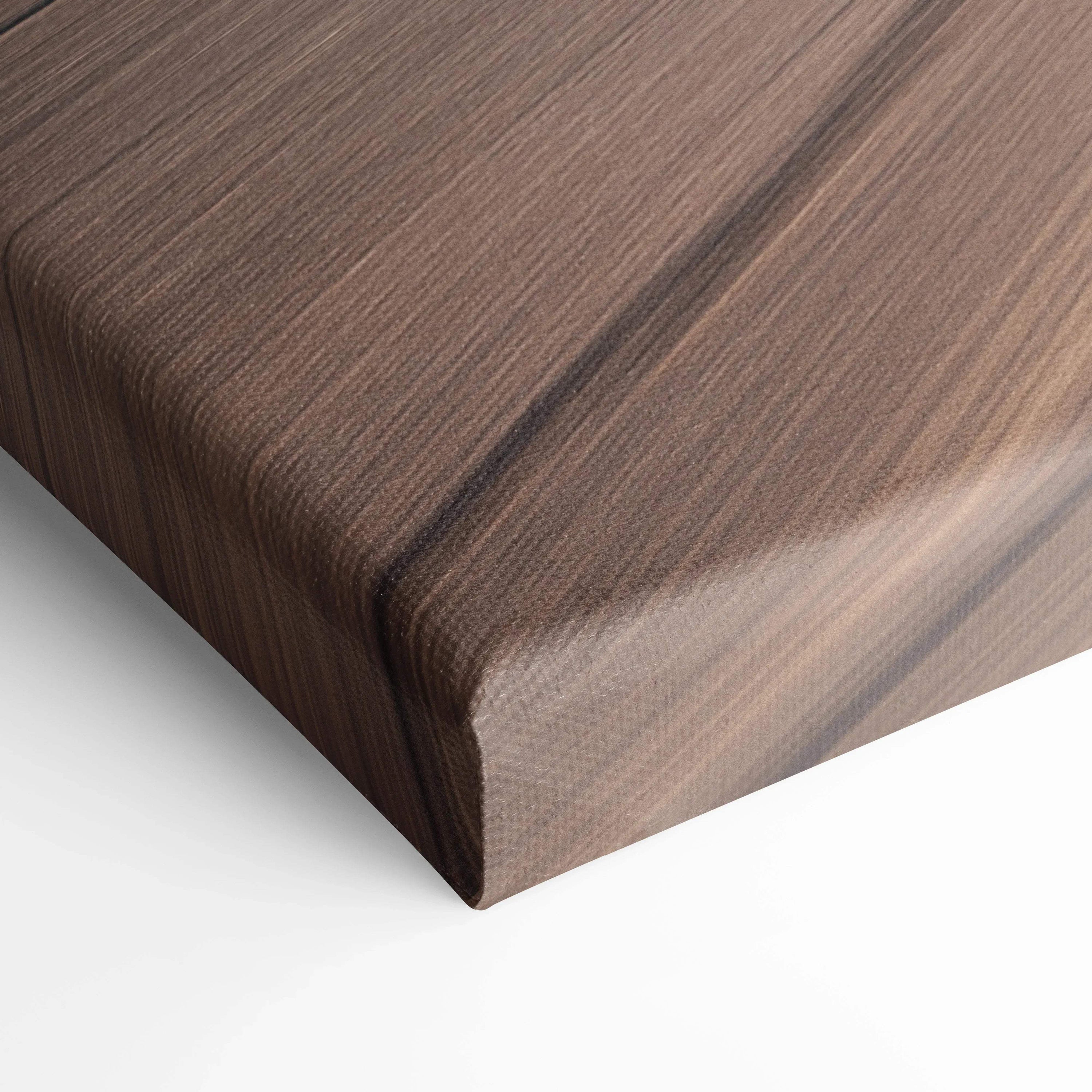 Close-up of wood-textured vertical canvas art wrap corner showcasing smooth edges and fine print quality for wall art.
