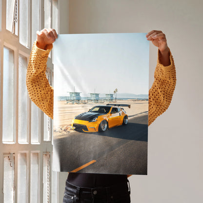 Poster of yellow Nissan 370z JDM car on coastal road, premium wall art for auto enthusiasts.