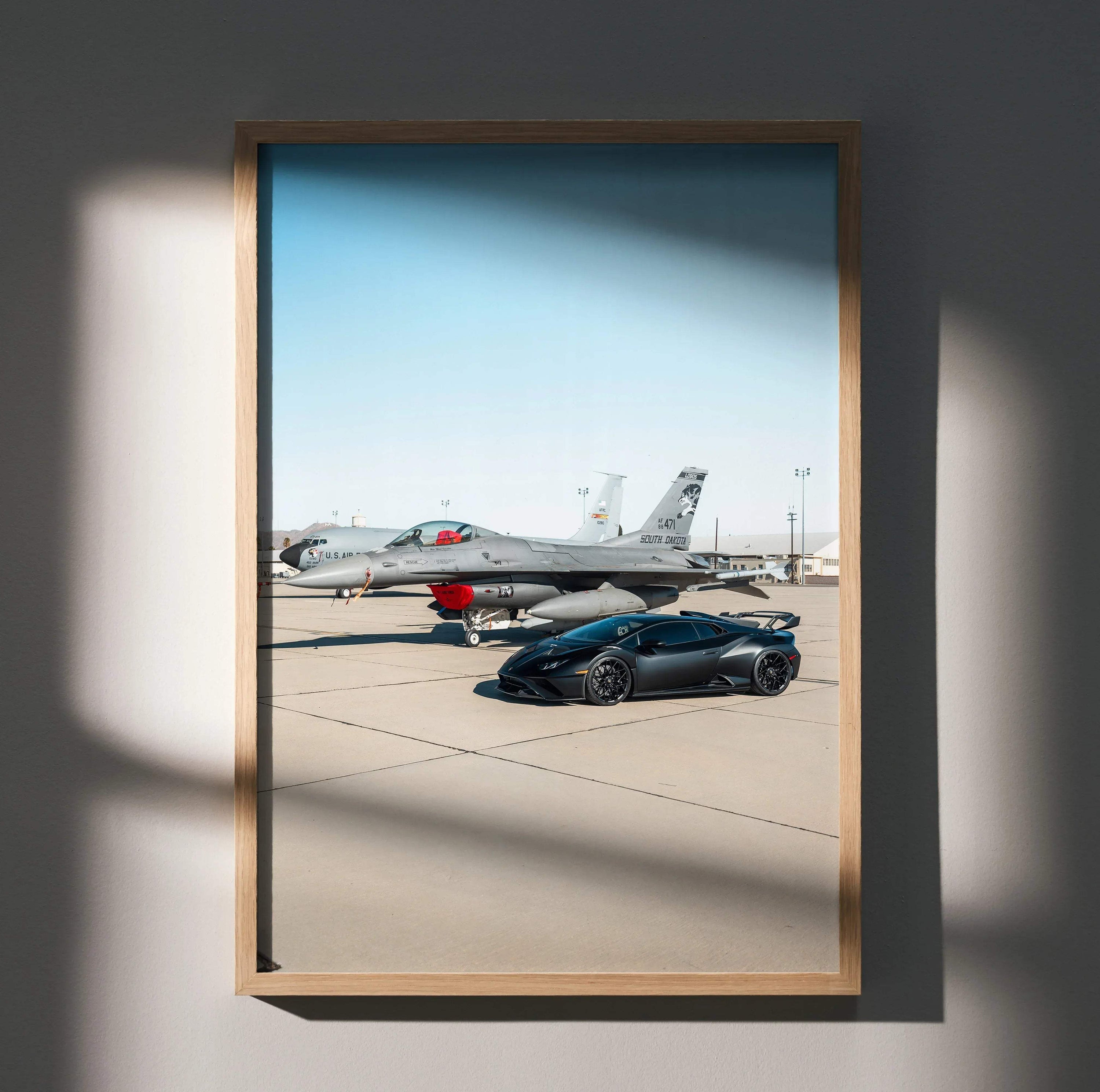 Lamborghini Huracan STO poster with sleek black car parked on runway near a jet, luxury wall art.