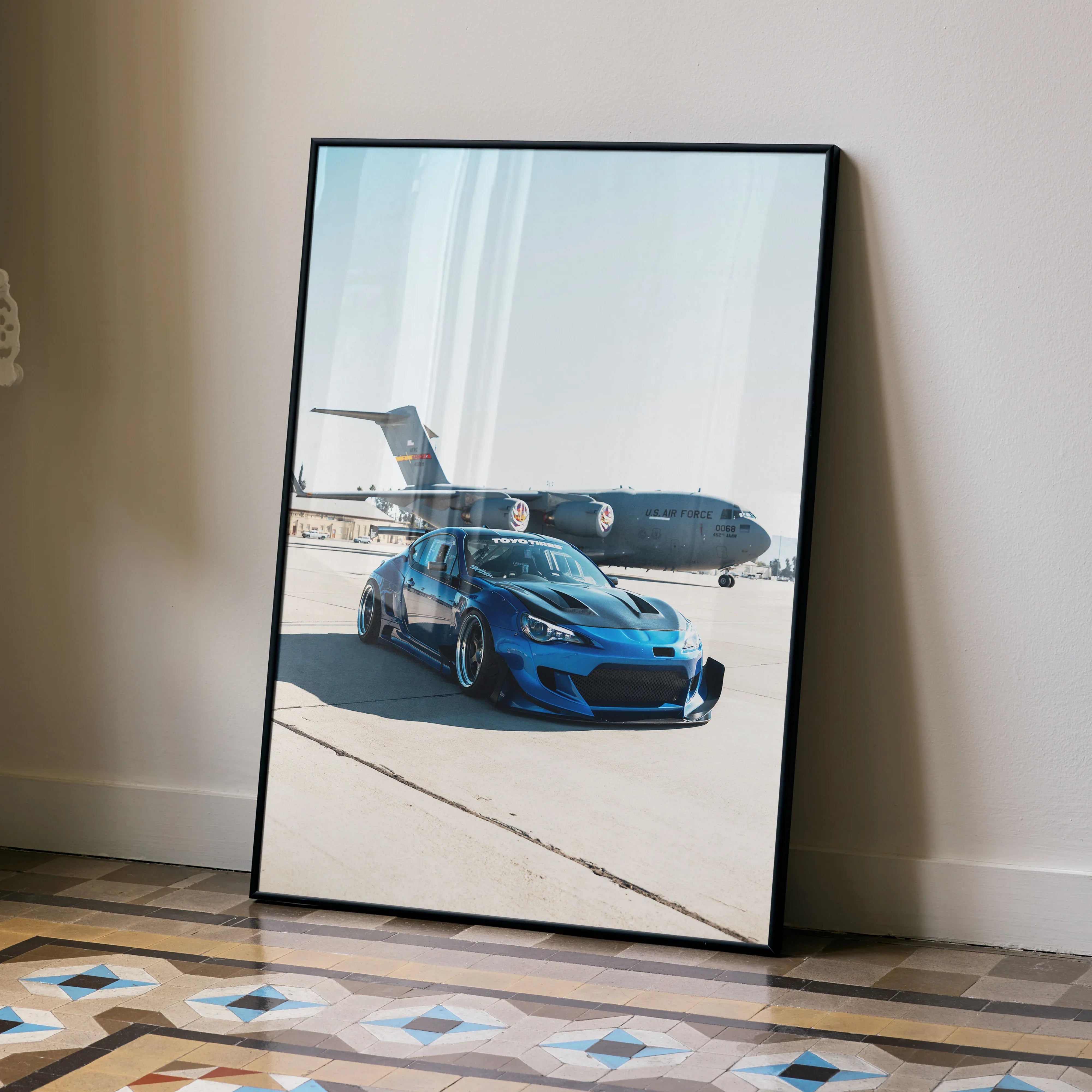 Sleek widebody blue Toyota FRS car poster with airplane backdrop, framed wall art decor.