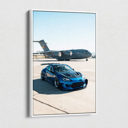 Blue Toyota FRS sports car with military jet in background vertical canvas wall art.