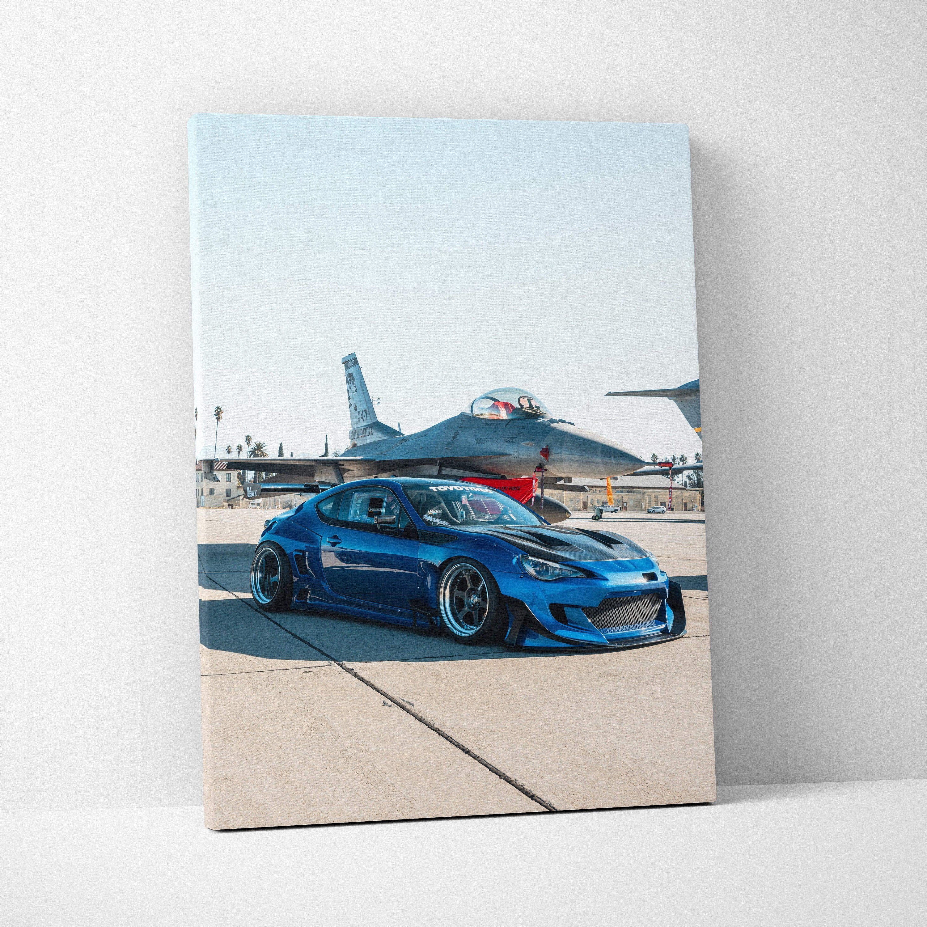 Blue Toyota FRS sports car canvas art with jet plane background vertical wall art.