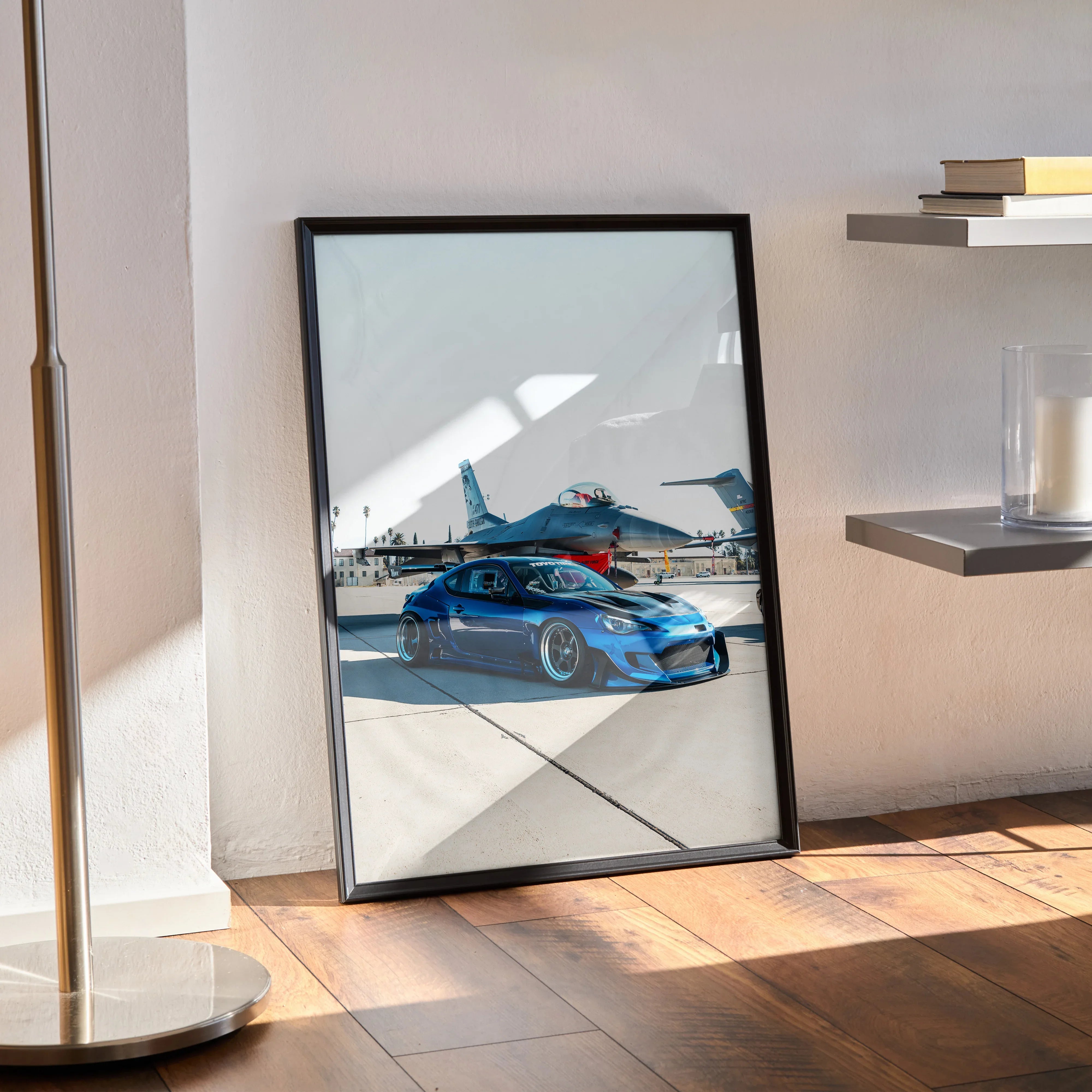 Sleek modified blue Toyota FRS car poster in black frame leaning against wall, wall art for enthusiasts.