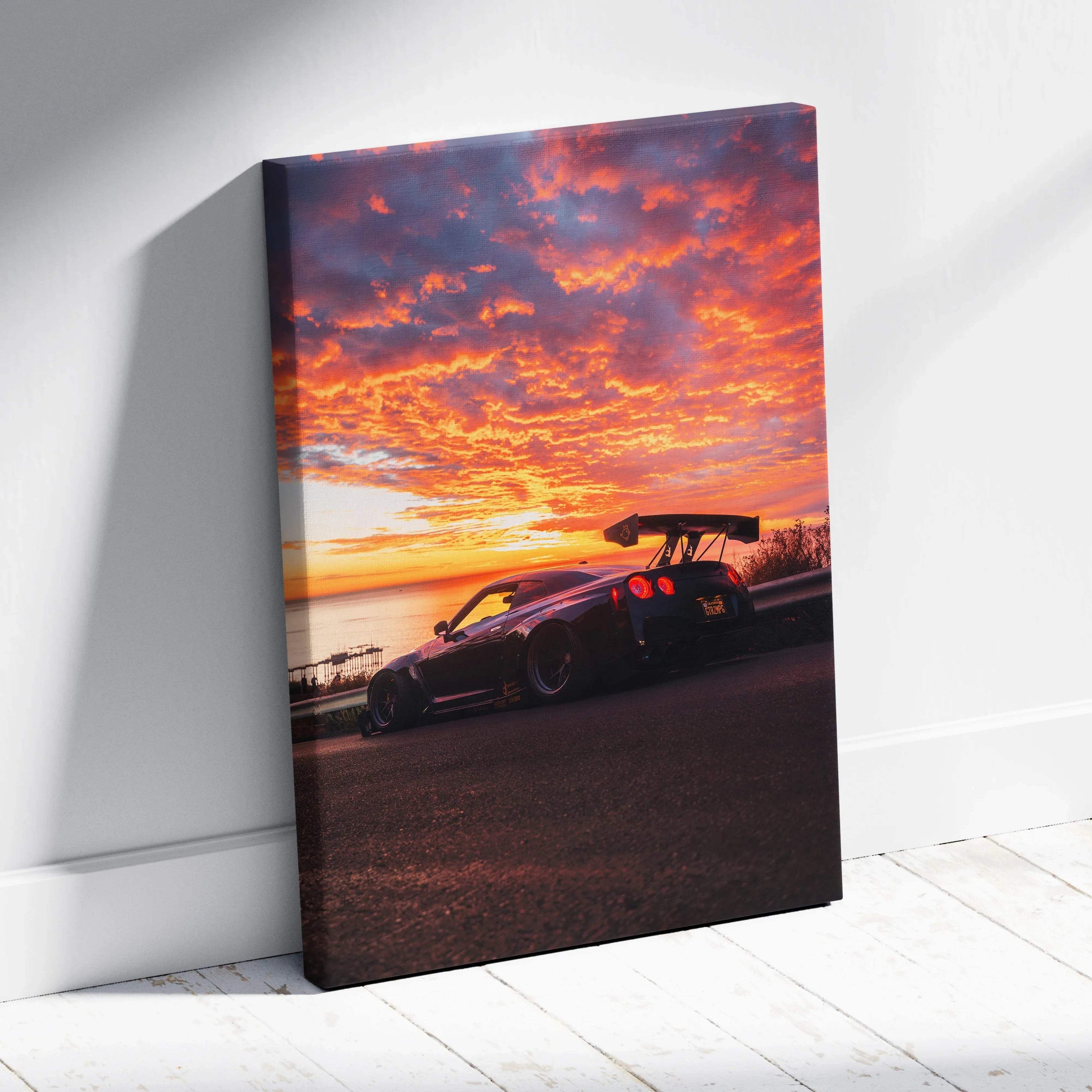 Nissan R35 GTR silhouette against vibrant sunset sky on vertical canvas wall art.