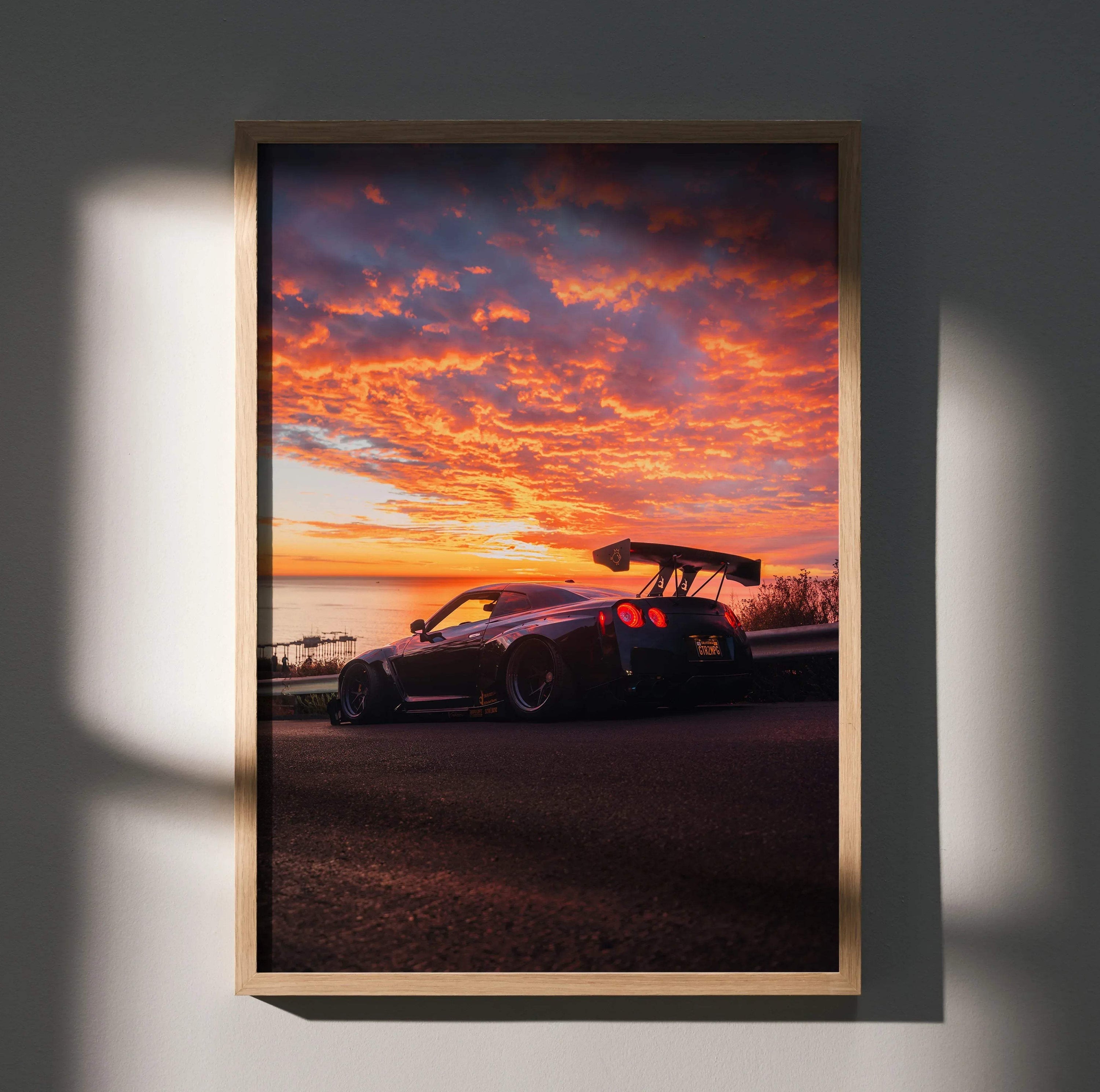 Nissan GT-R R35 Widebody parked at sunset with vibrant orange sky poster wall art.