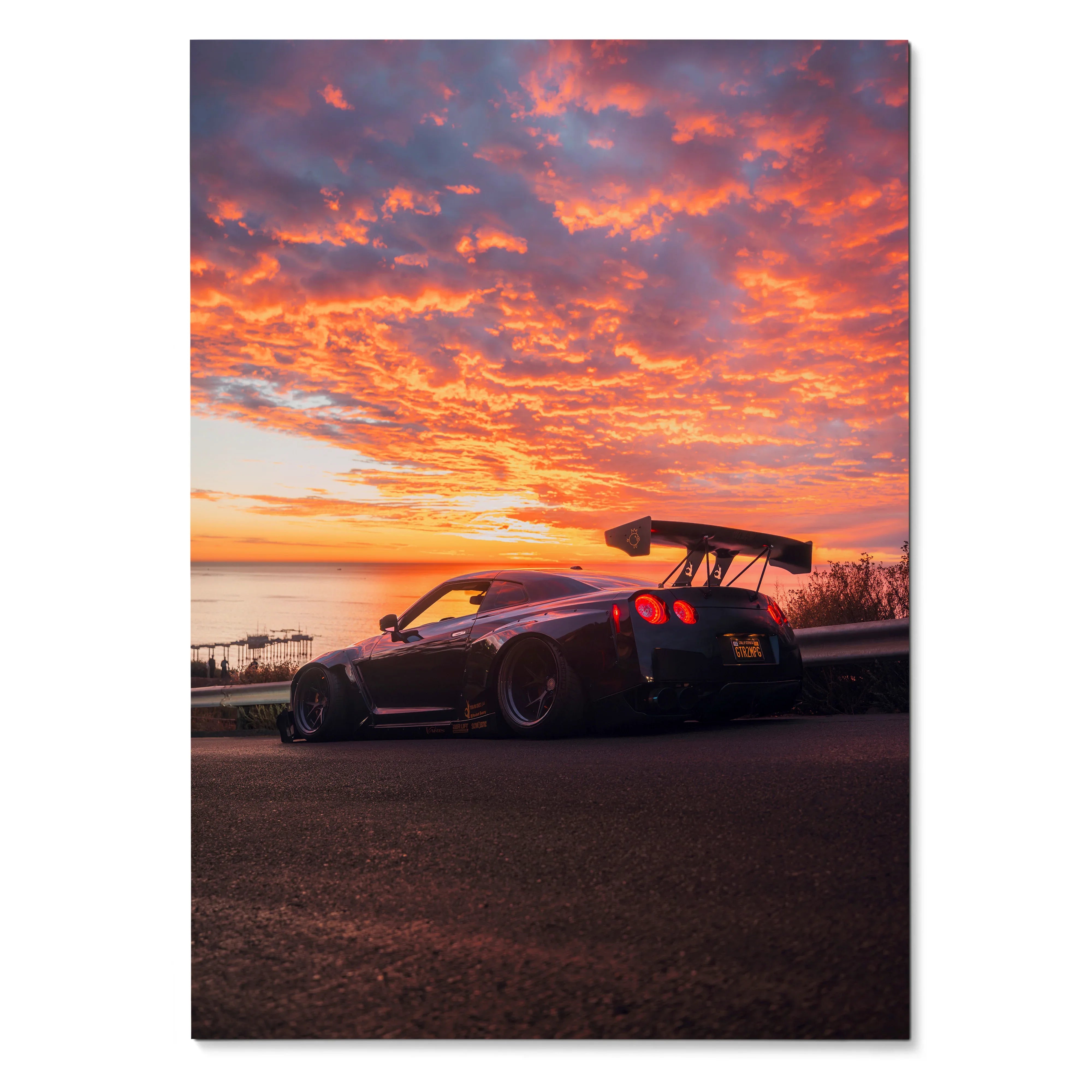 Nissan GT-R R35 widebody parked at sunset with dramatic orange and purple sky poster wall art.