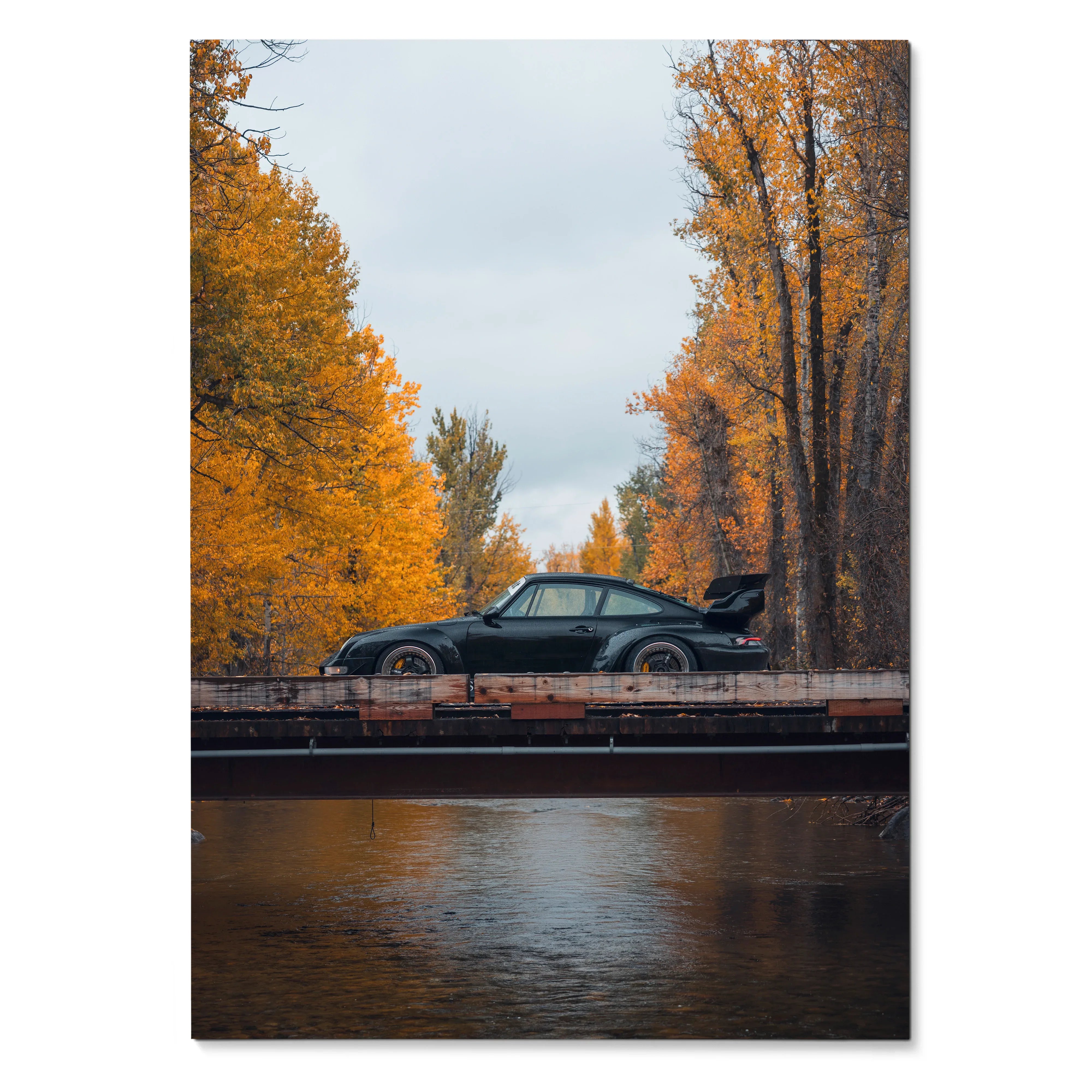 RWB Porsche 911 poster wall art with black car on bridge framed by autumn trees and reflective water.
