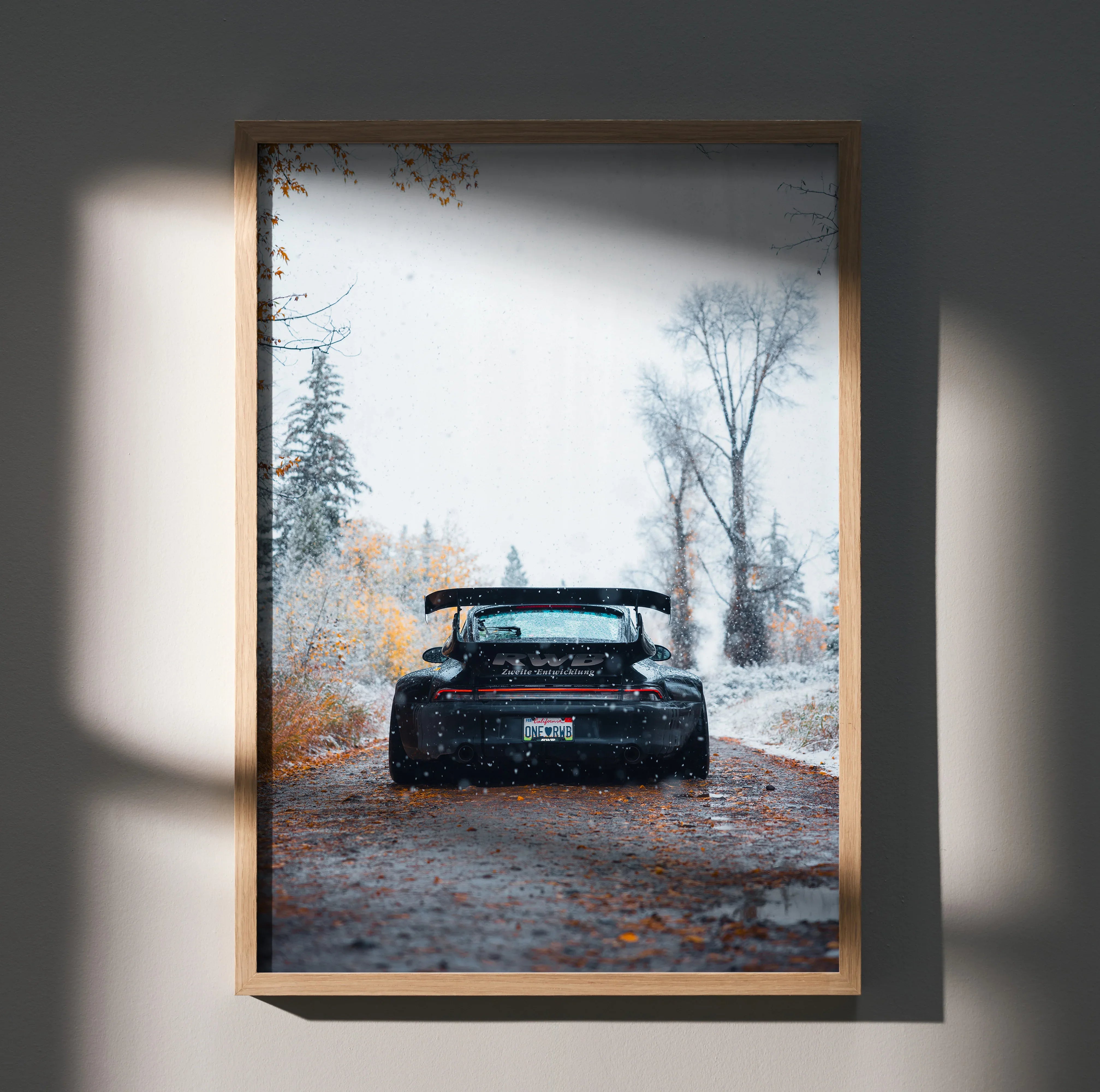 RWB Porsche 911 black car on autumn road poster wall art in natural wood frame.