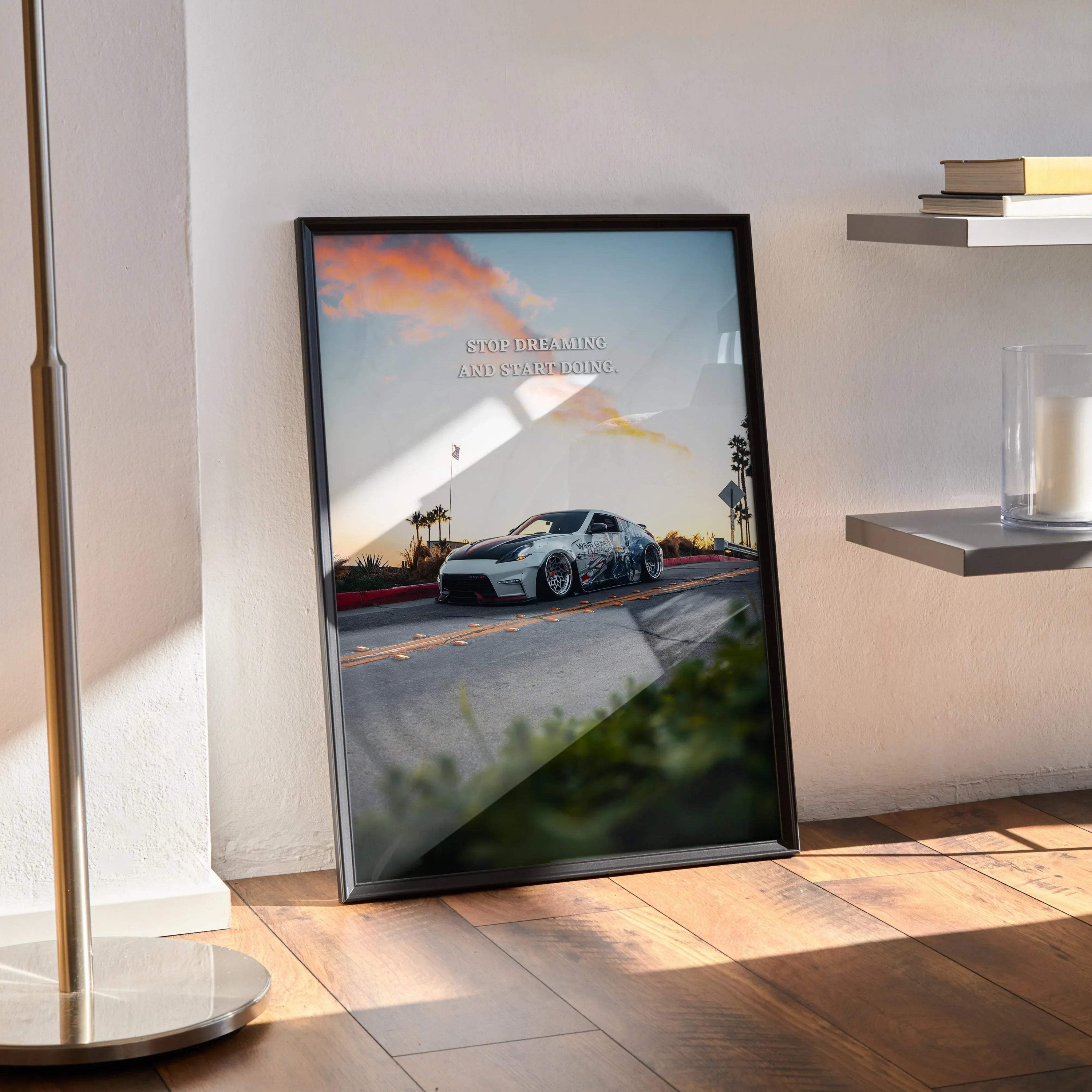 Nissan 370z motivational poster with inspiring text framed wall art angled on wooden floor near modern shelf and lamp.