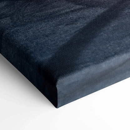 Close-up of black textured canvas wall art with sleek, high-quality surface and sharp wrapped edges.