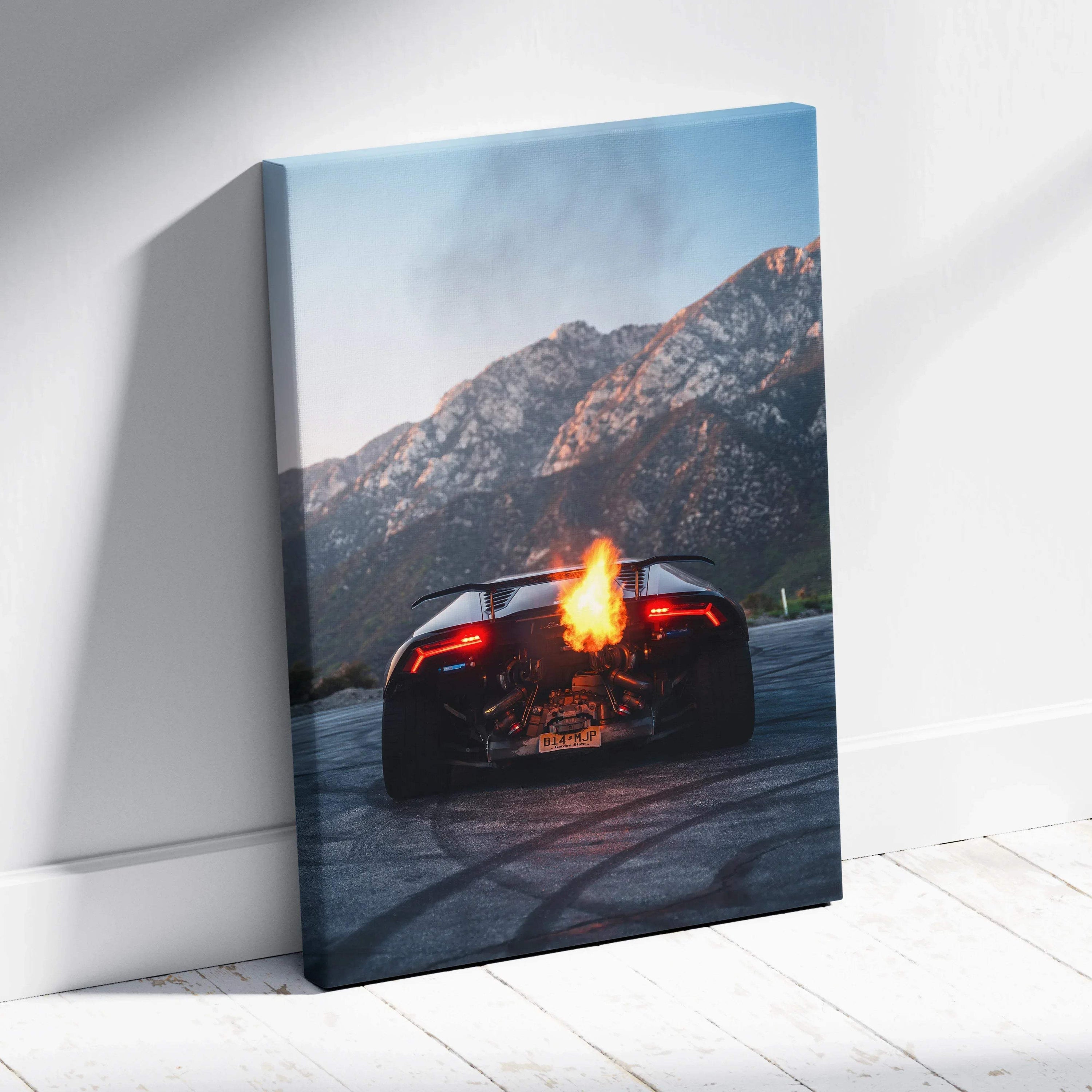 Lamborghini Huracan rear view with flames on asphalt mountain canvas wall art.