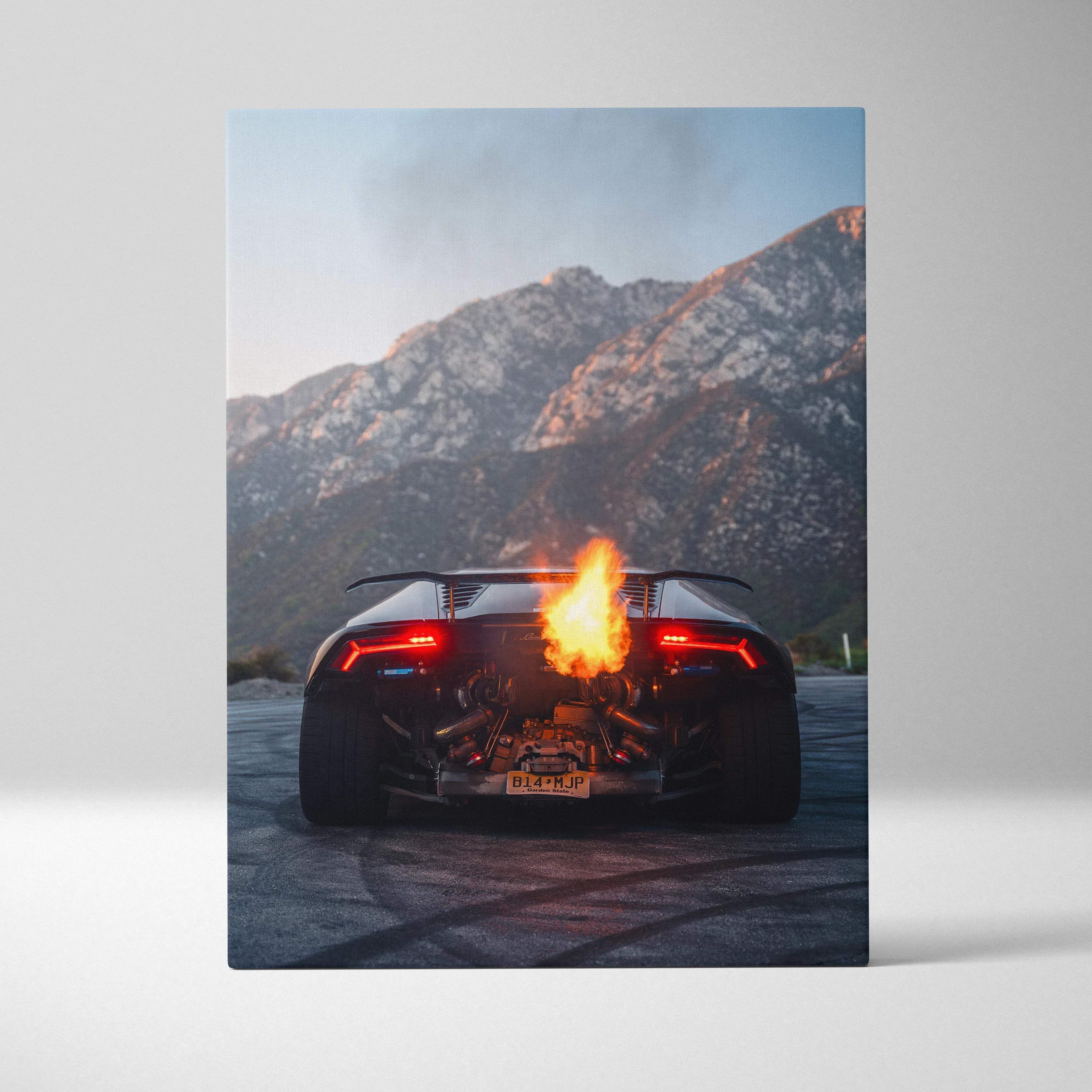 Black Lamborghini Huracán fiery exhaust canvas print featuring vertical museum quality wall art with mountain backdrop
