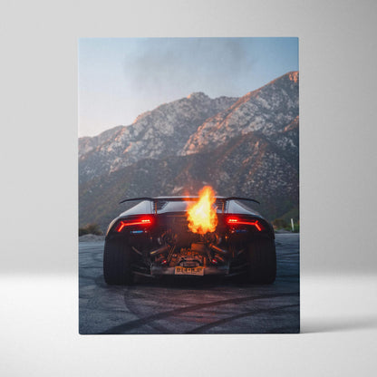 Lamborghini Huracan rear view with flame exhaust on canvas wall art against mountain backdrop.