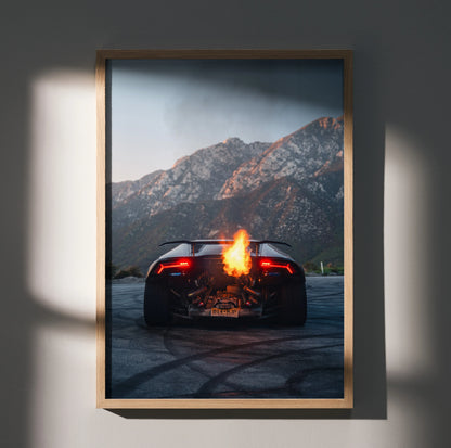 Lamborghini Huracan wall art poster with fiery flames and mountain backdrop in wooden frame.